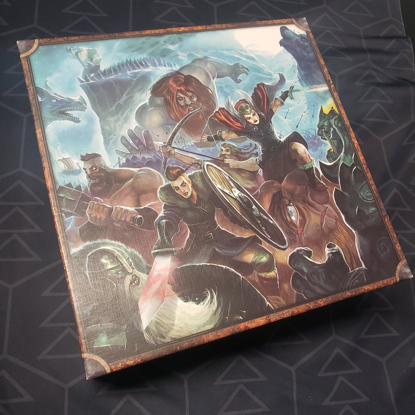 Image shows the front cover of the box of the Jarl Edition of the board game Champions of Midgard
