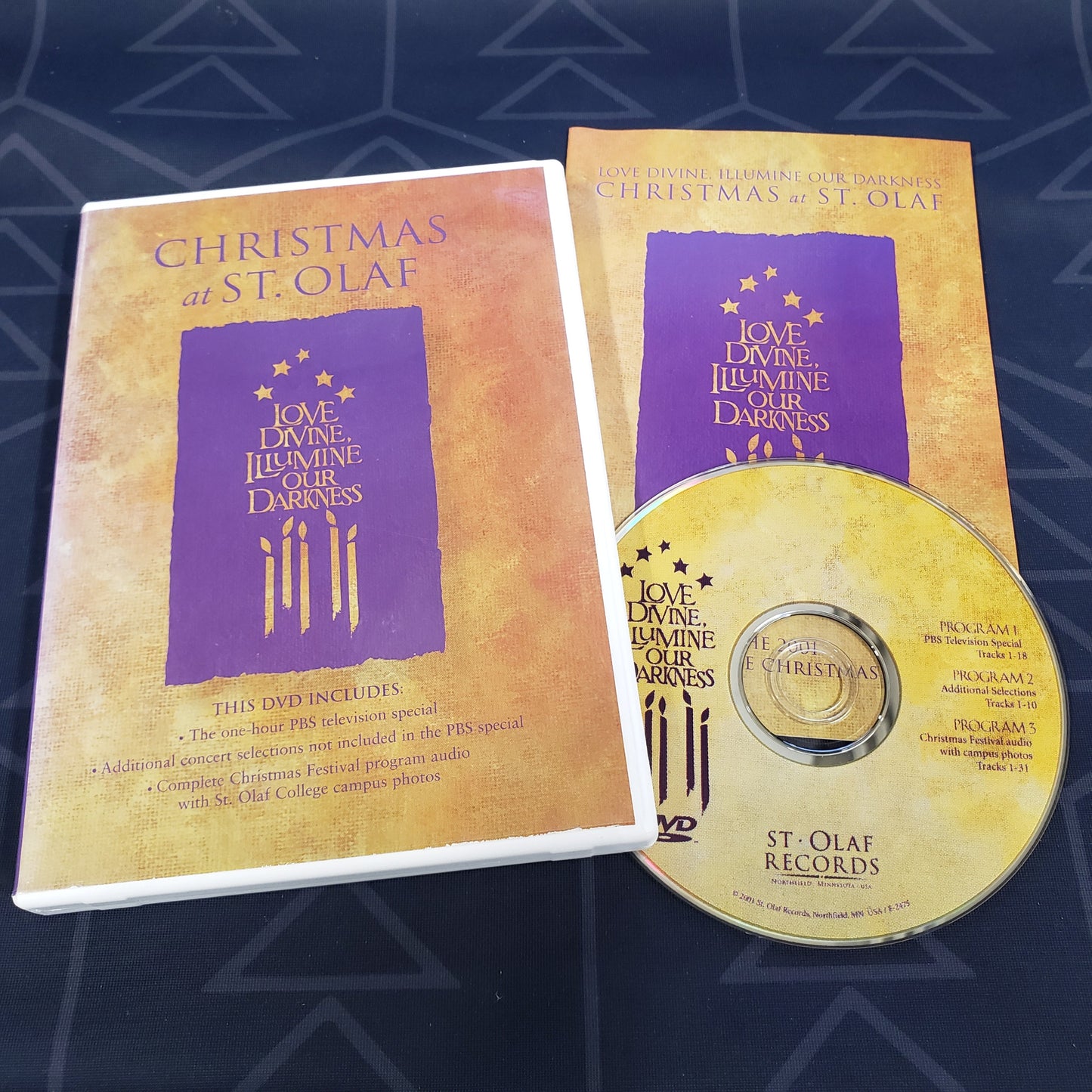 Image shows the case, insert & disc for the concert film Christmas at St. Olaf: Love Divine, Illuminate Our Darkness on DVD