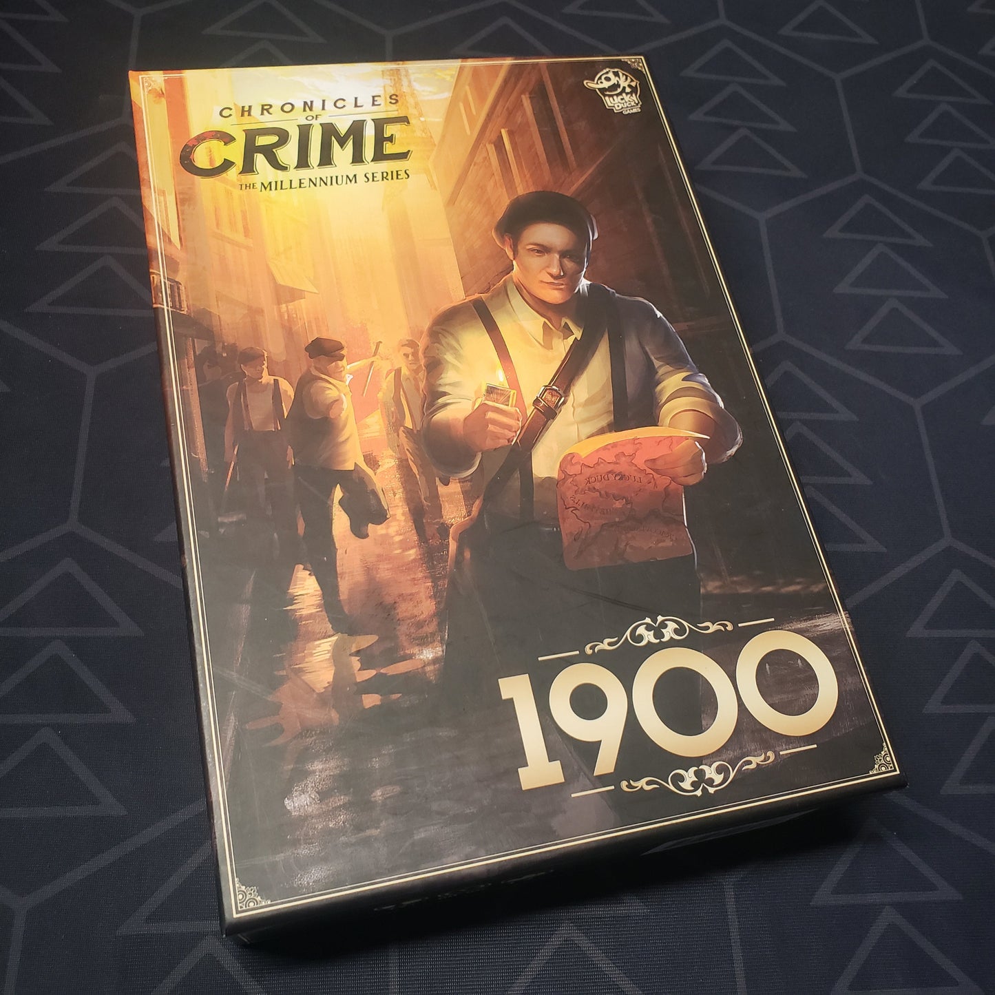 Image shows the front cover of the box for the Chronicles of Crime: 1900 board game