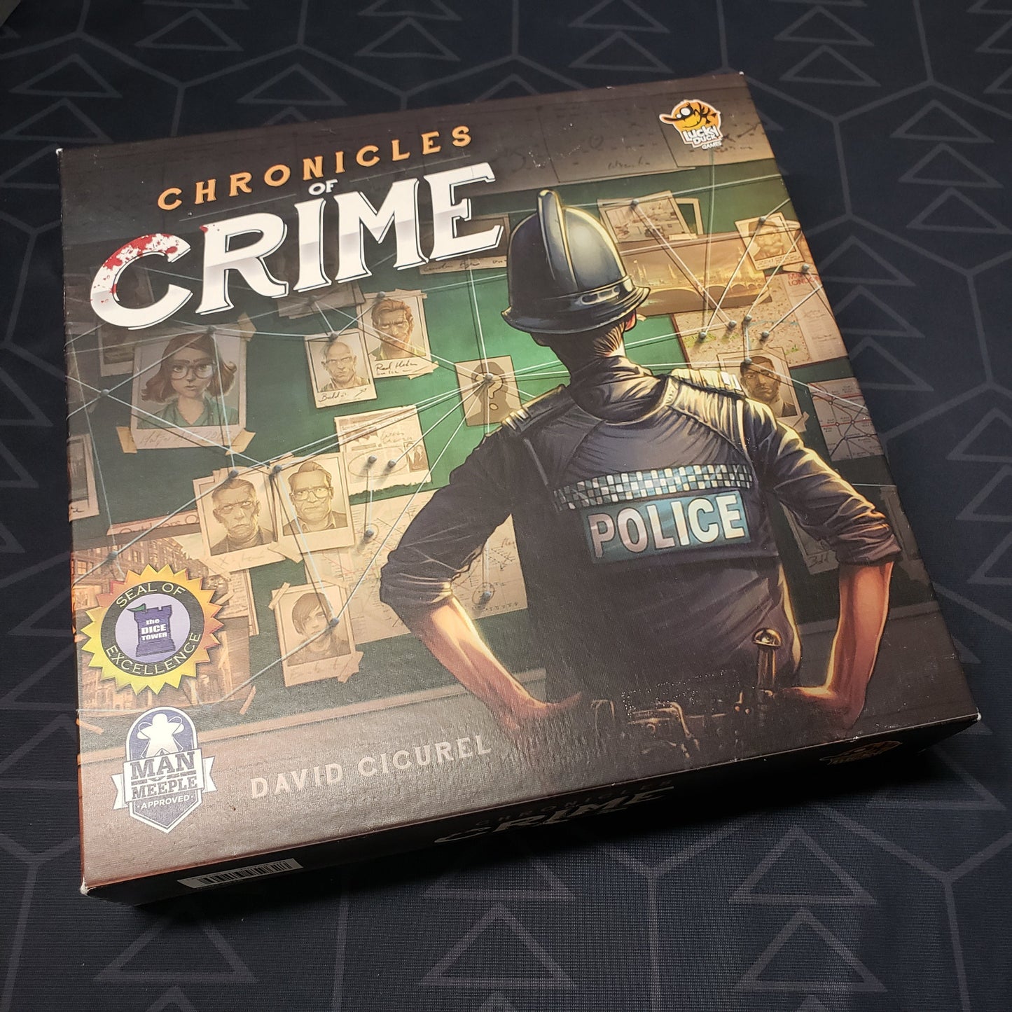 Image shows the front cover of the box of the Chronicles of Crime board game