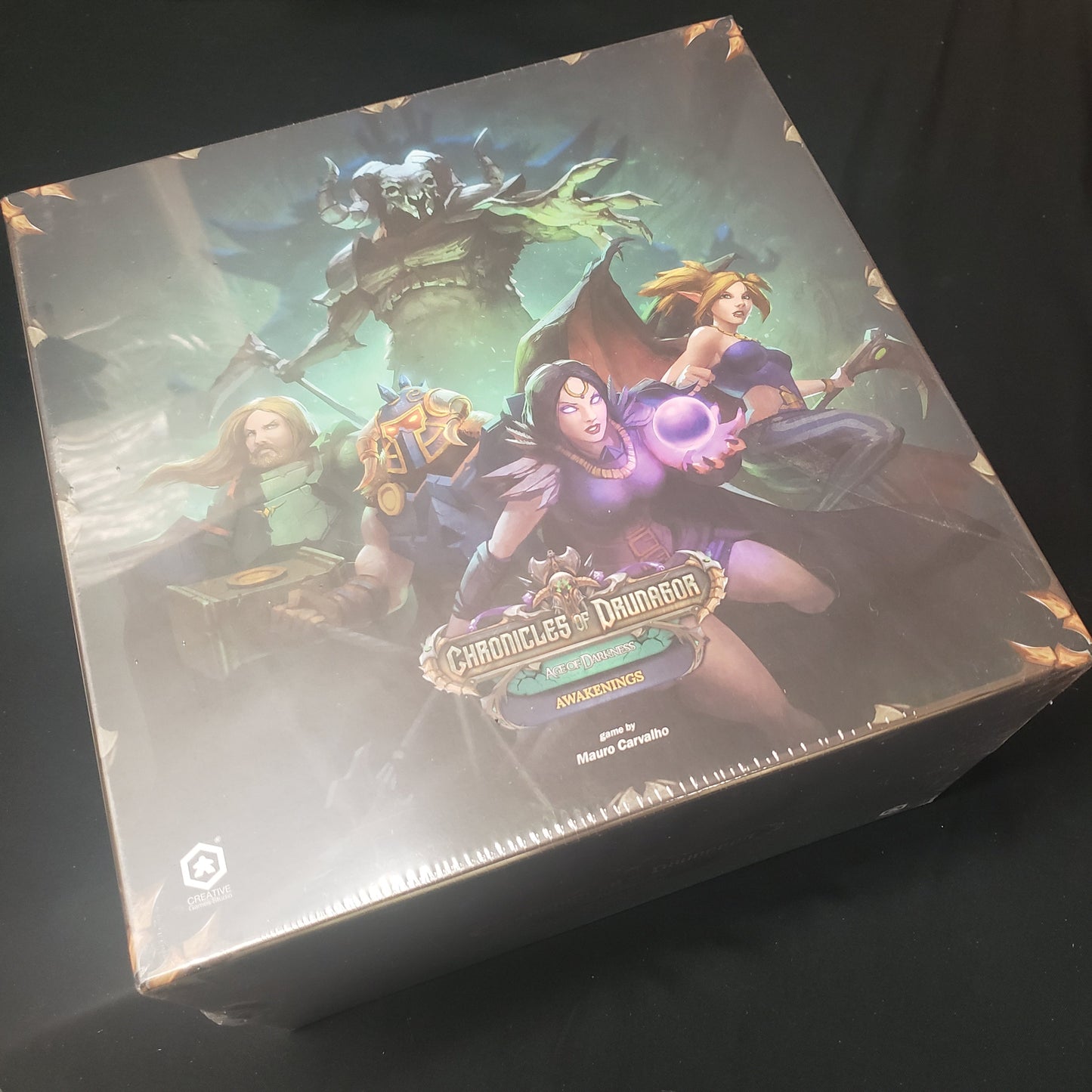 Image shows the front cover of the box of the Awakenings expansion for the board game Chronicles of Drunagor: Age of Darkness