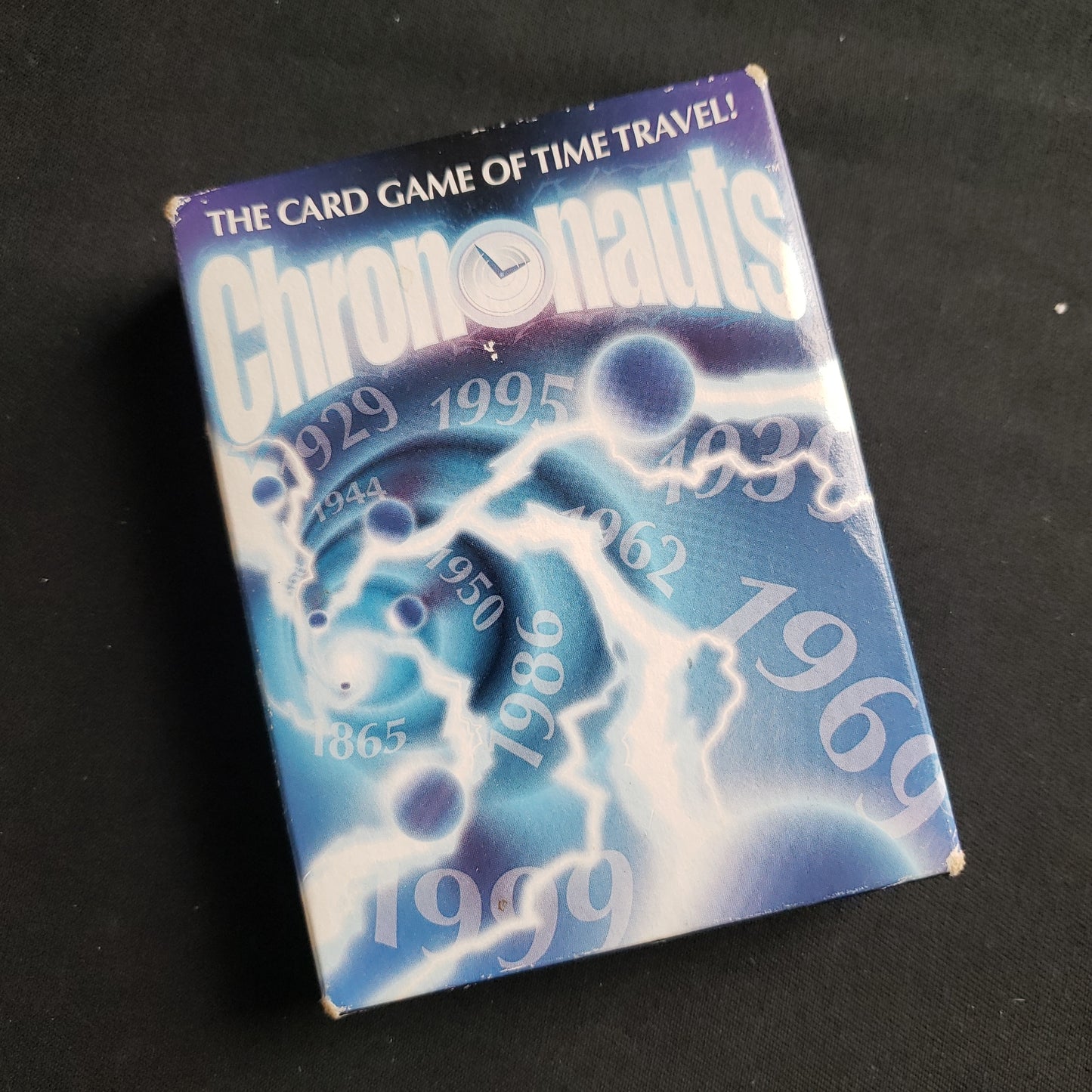 Image shows the front cover of the box of the Chrononauts card game