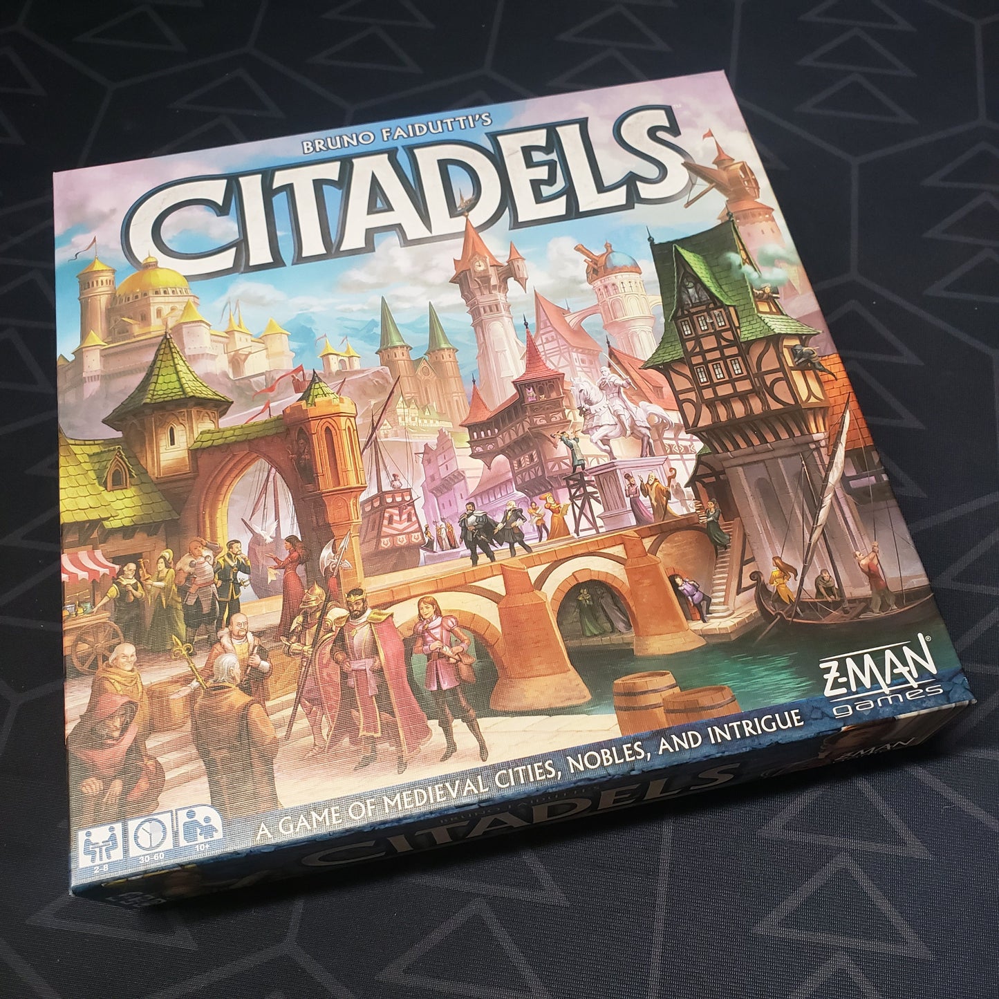 Image shows the front cover of the box of the Citadels board game