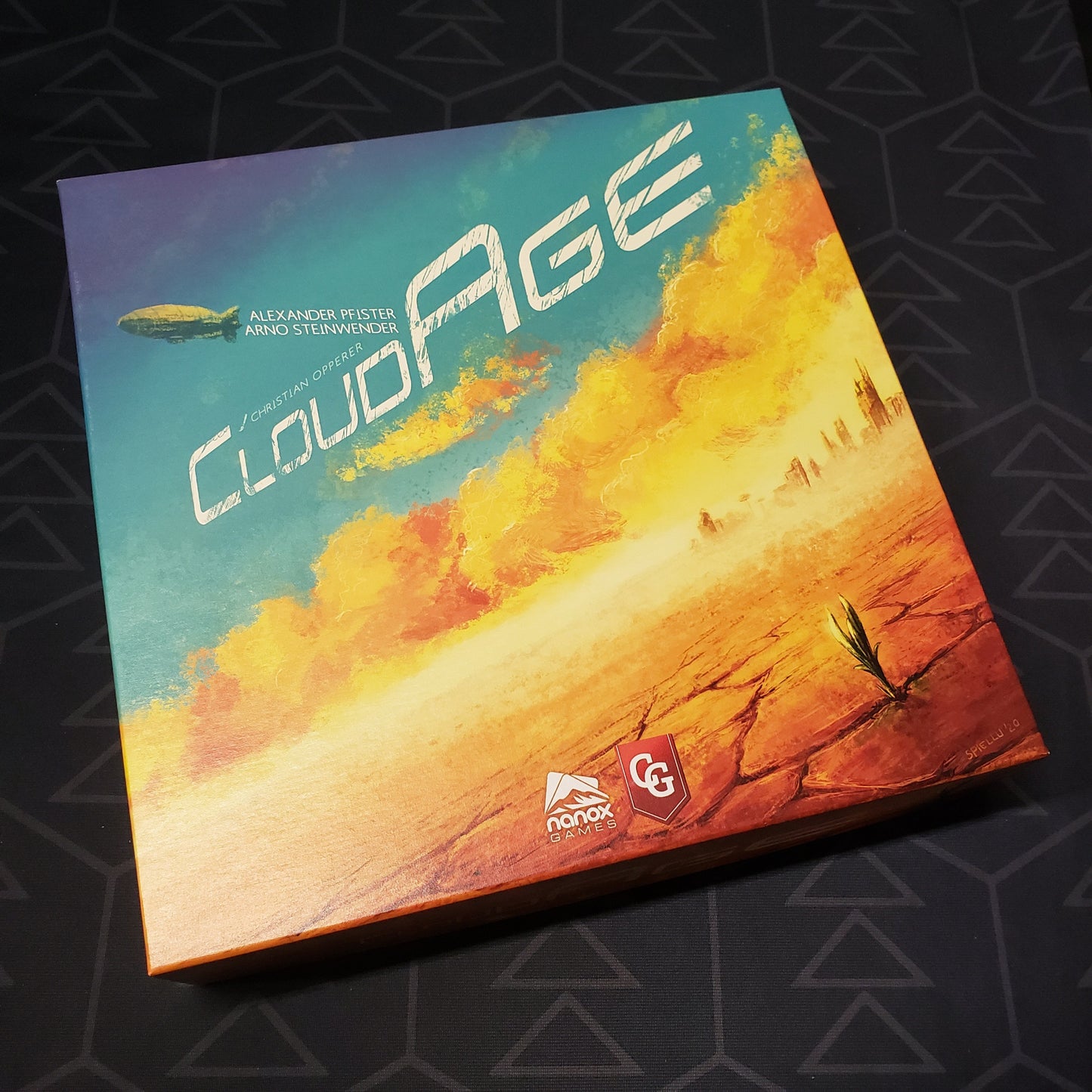 Image shows the front cover of the box of the CloudAge board game