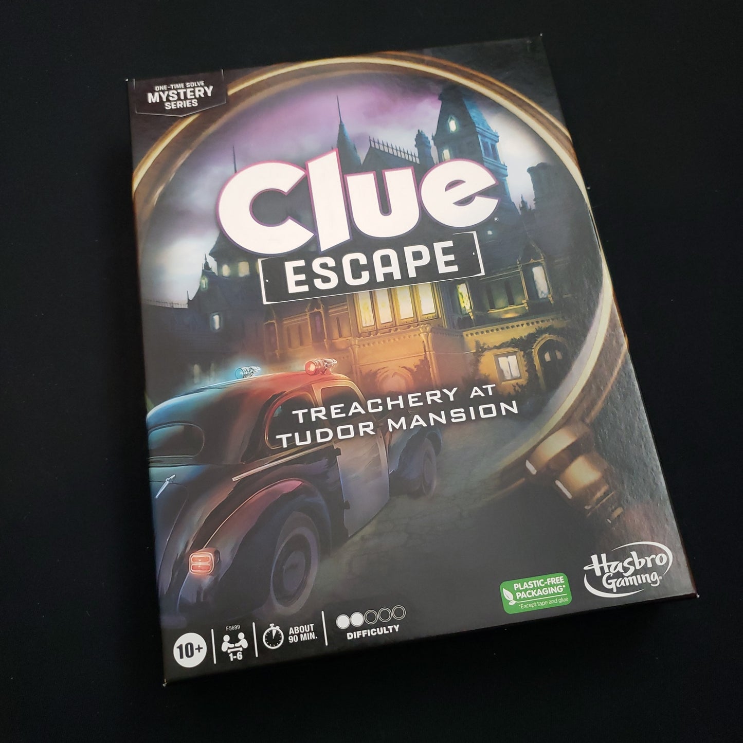 Image shows the front cover of the box of the Clue Escape: Treachery at Tudor Mansion board game