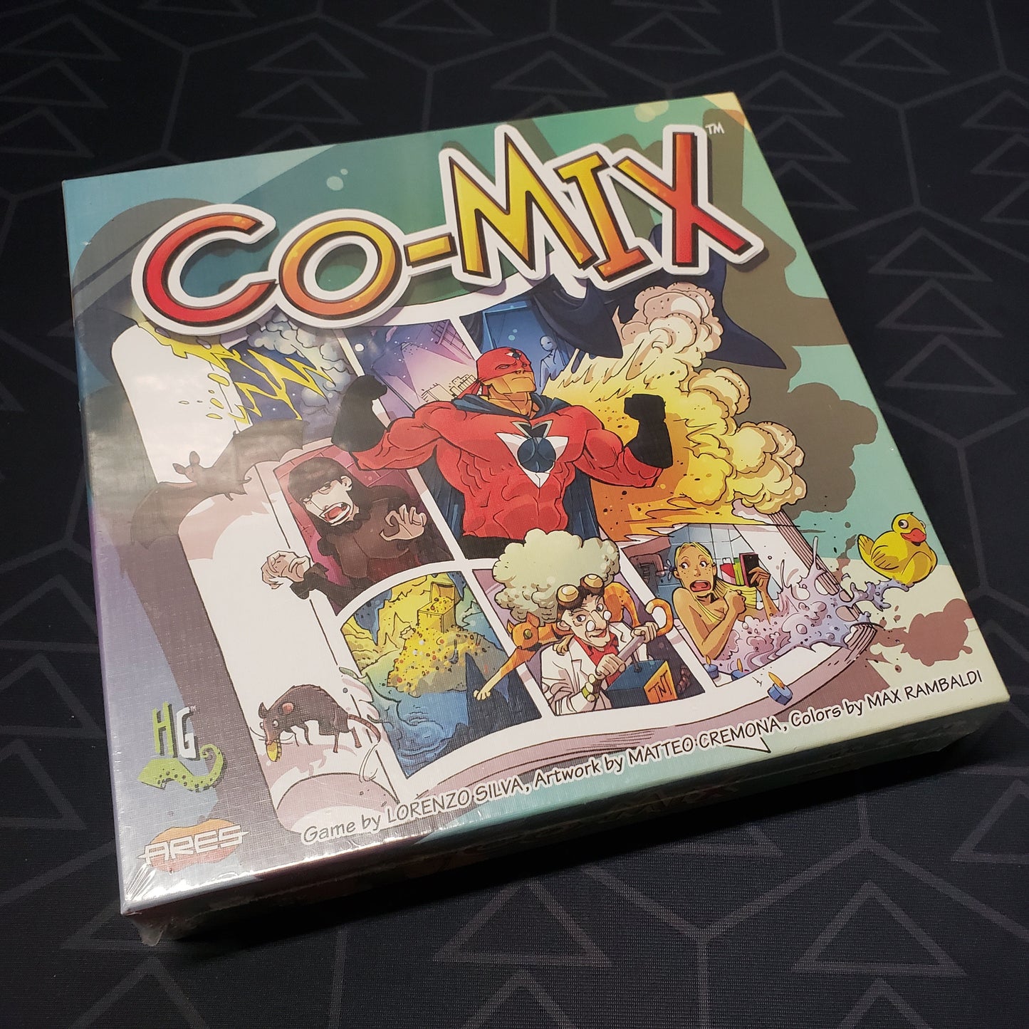 Image shows the front cover of the box for the Co-Mix board game