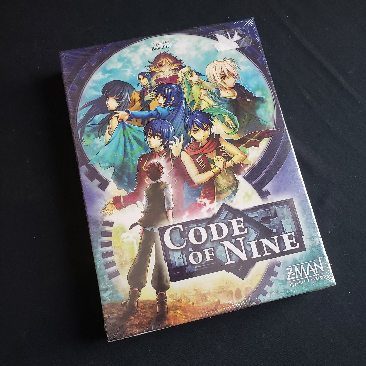 Image shows the front cover of the box of the Code of Nine board game