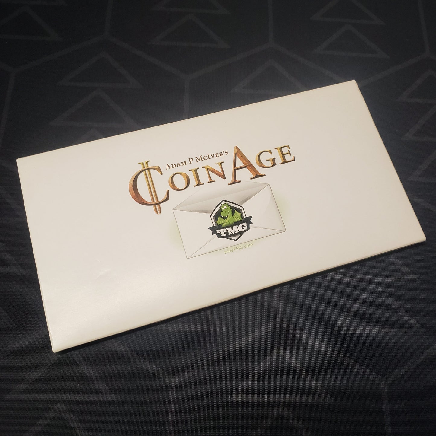 Image shows the front of the package for the Coin Age board game