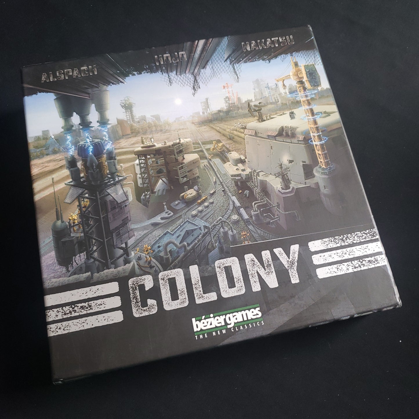 Image shows the front cover of the box of the Colony card game