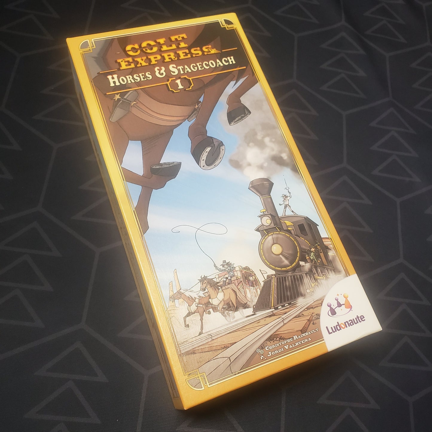 Image shows the front cover of the box of the Horses & Stagecoach expansion for the board game Colt Express