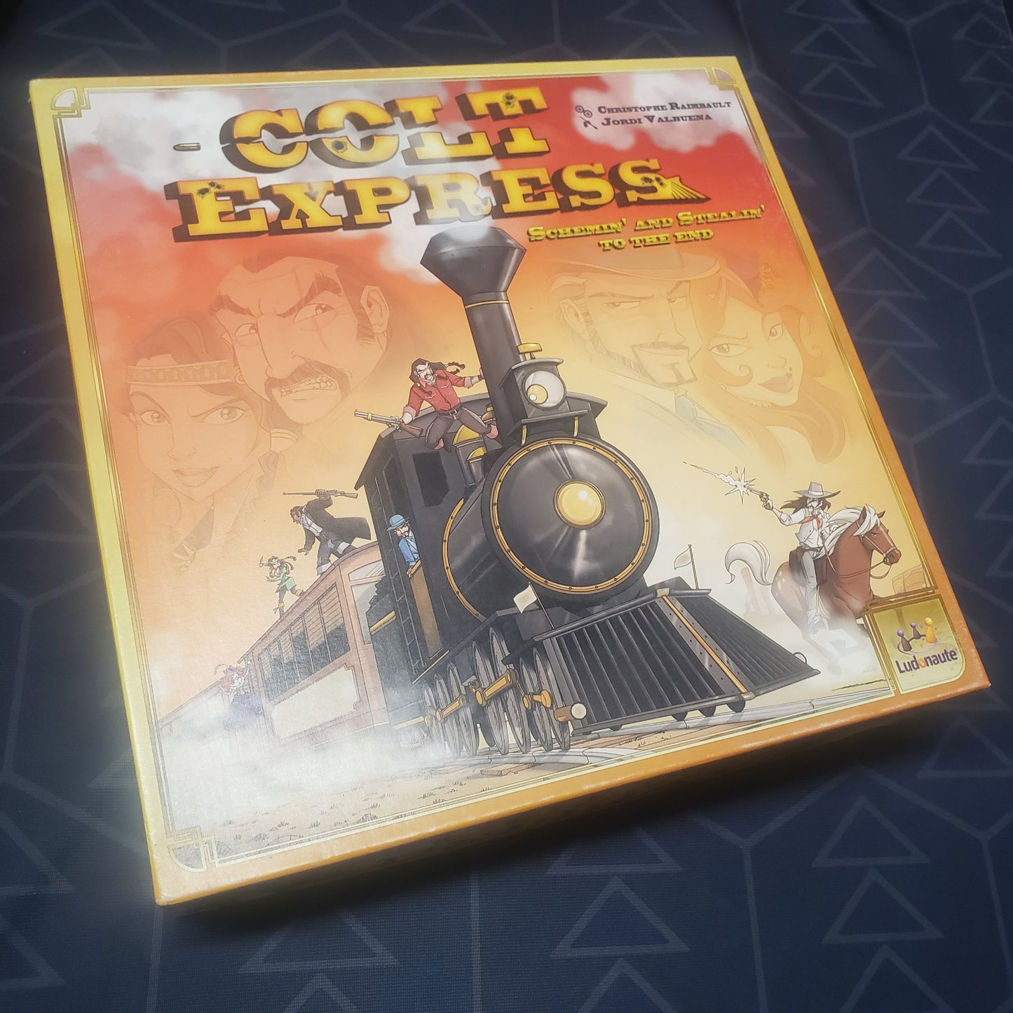 Image shows the front cover of the box of the Colt Express board game