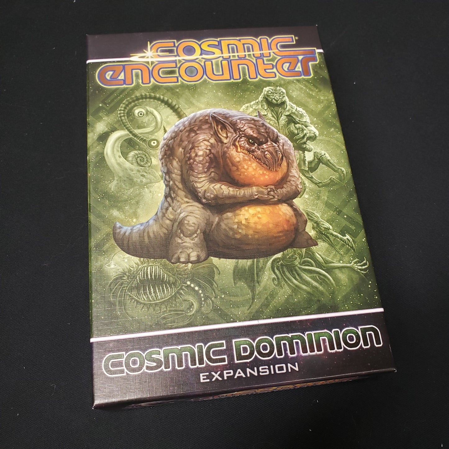 Image shows the front cover of the box for the Cosmic Dominion expansion from the board game Cosmic Encounter