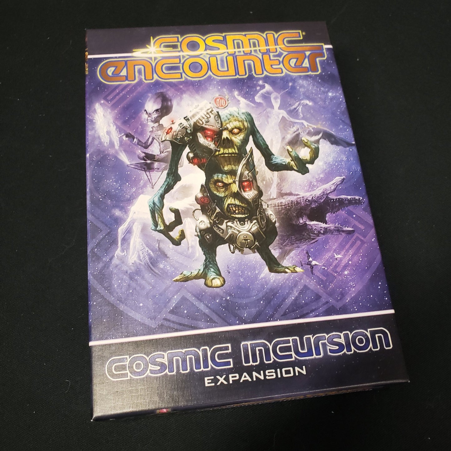 Image shows the front cover of the box for the Cosmic Incursion expansion from the board game Cosmic Encounter
