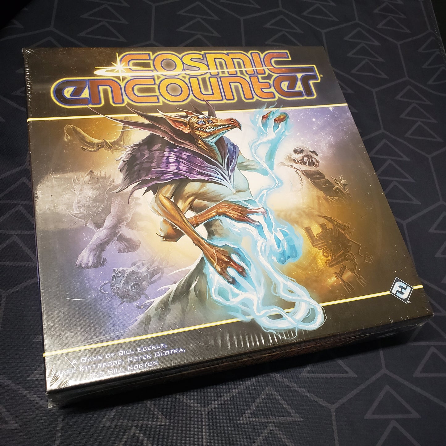 Image shows the front cover of the box of the Cosmic Encounter board game