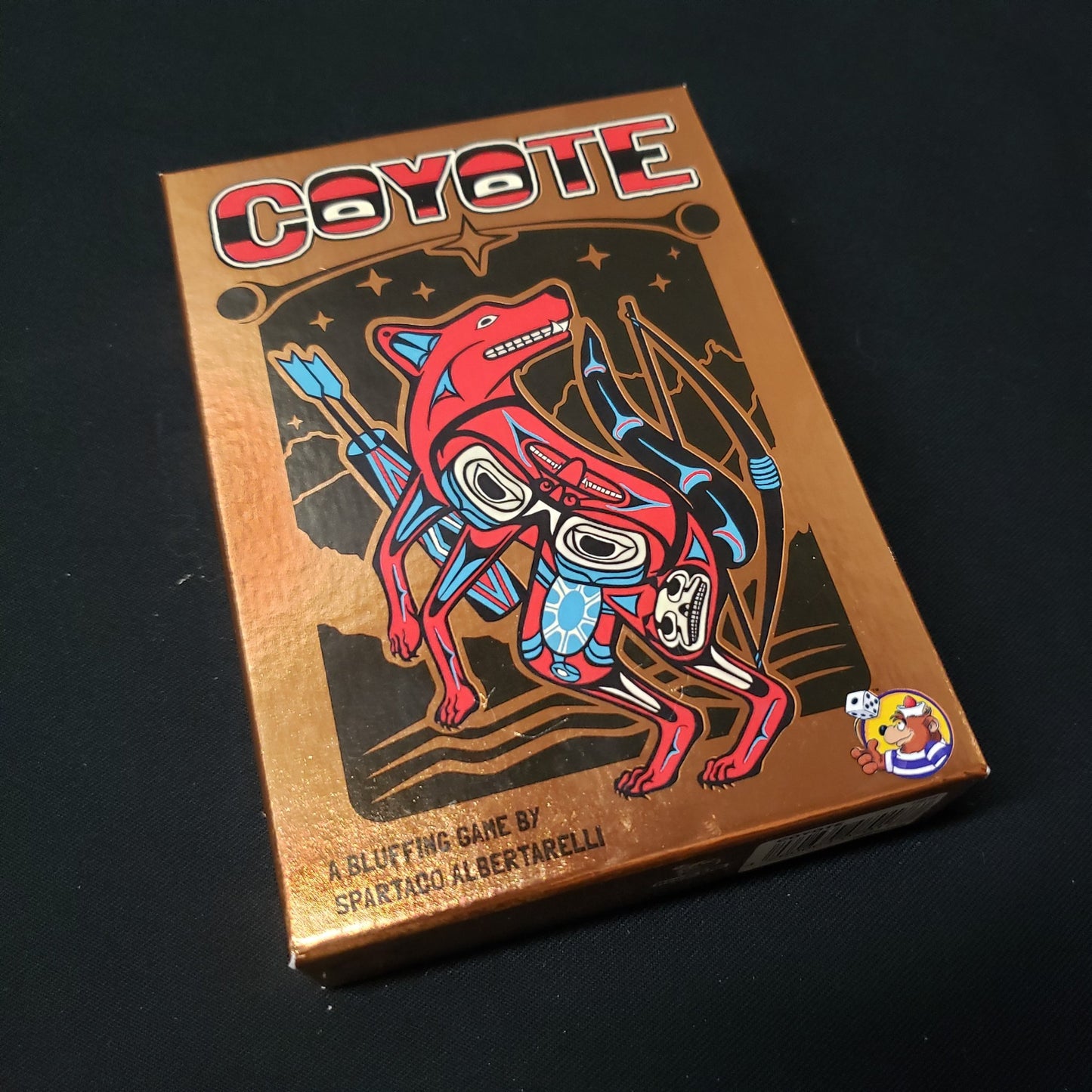 Image shows the front cover of the box of the Coyote card game