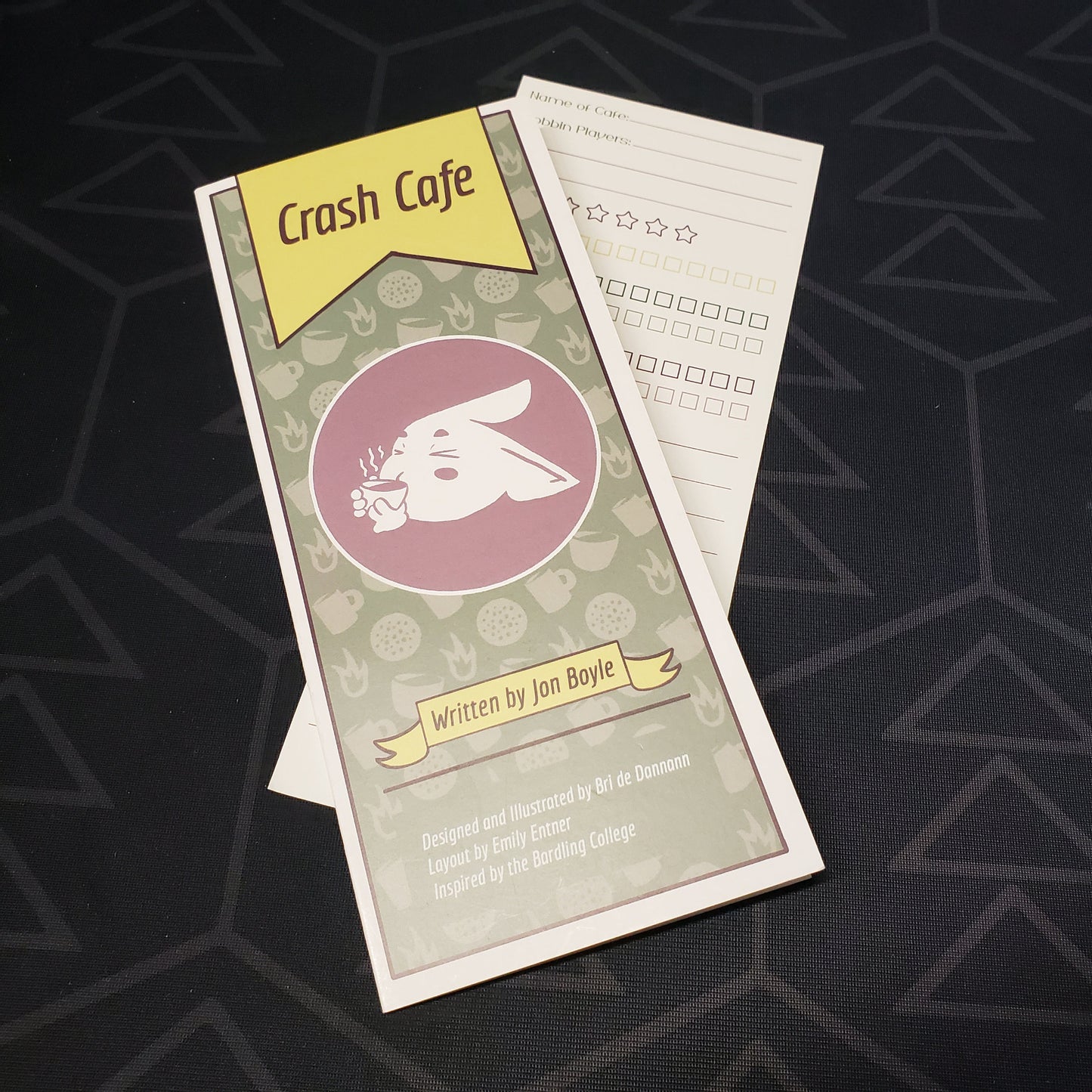 Image shows the front of the Crash Cafe roleplaying game pamphlet