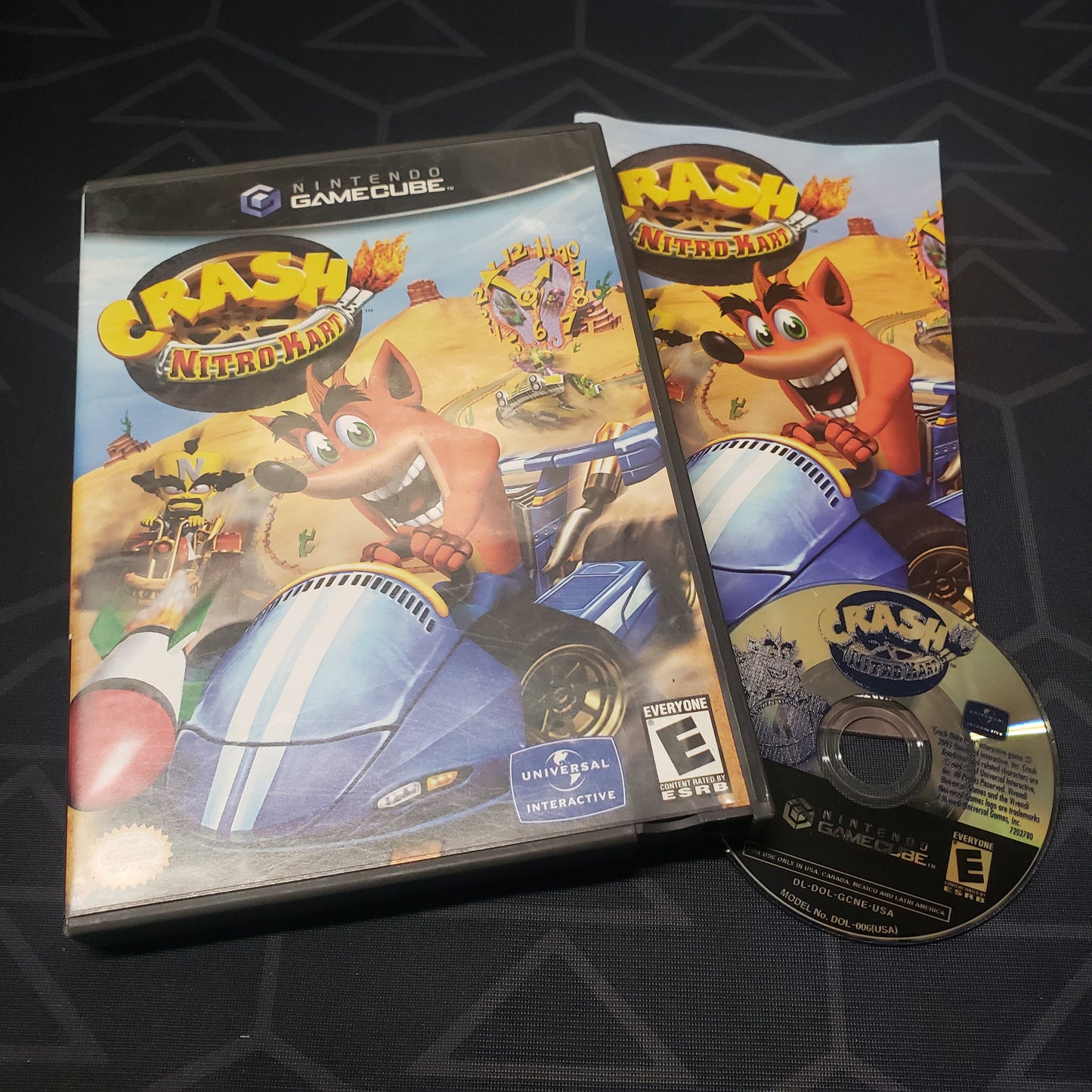 Image shows the case, manual and disc for the video game Crash: Nitro Kart for Nintendo GameCube