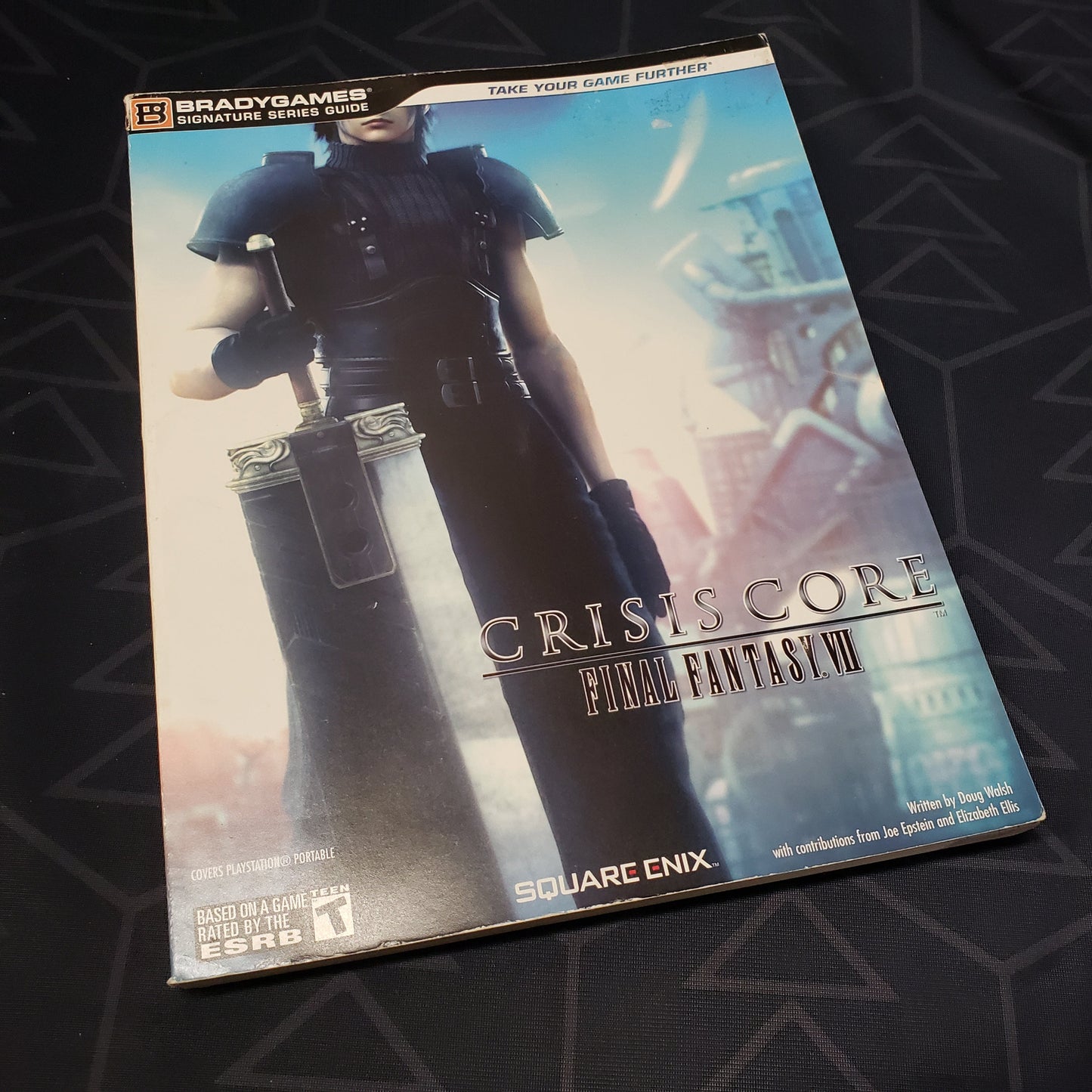 Image shows the front cover of the Crisis Core: Final Fantasy VII strategy guide book