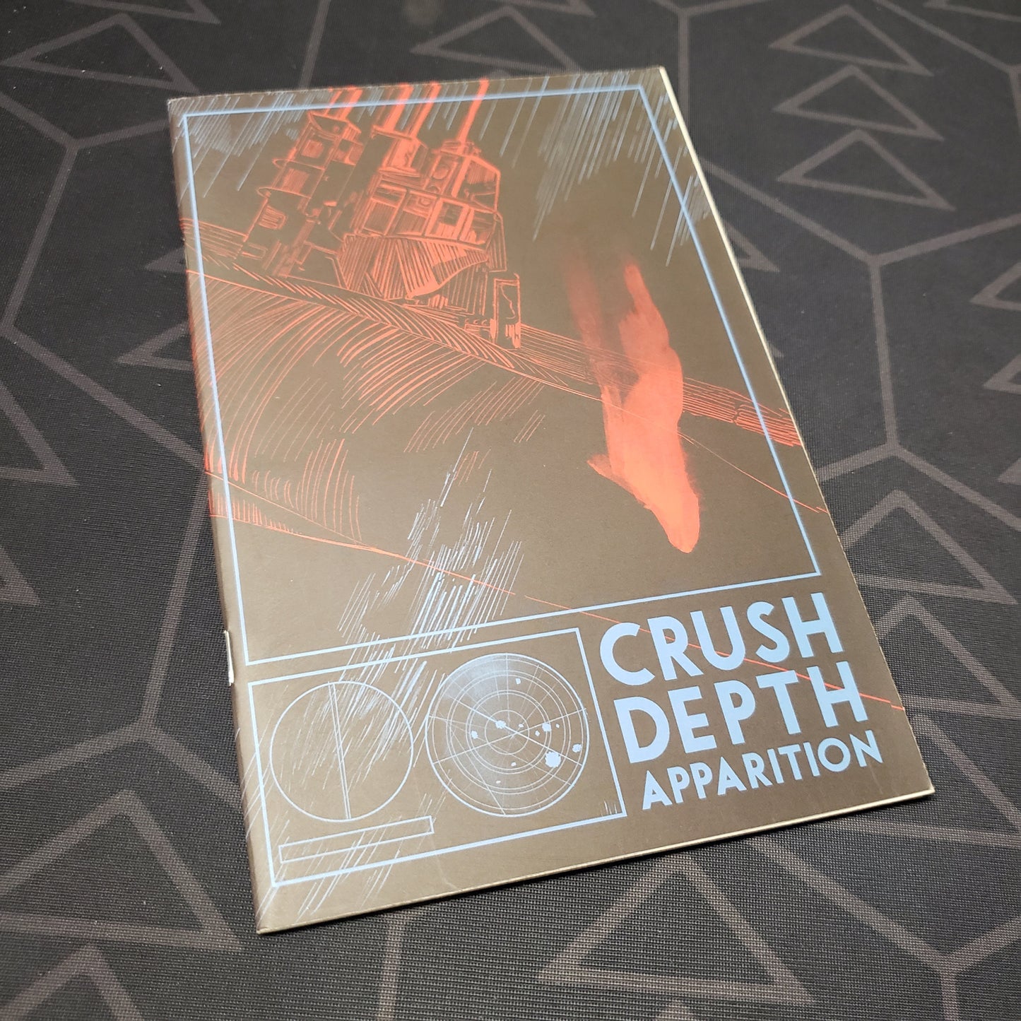 Image shows the front cover of the Crush Depth Apparition roleplaying game book