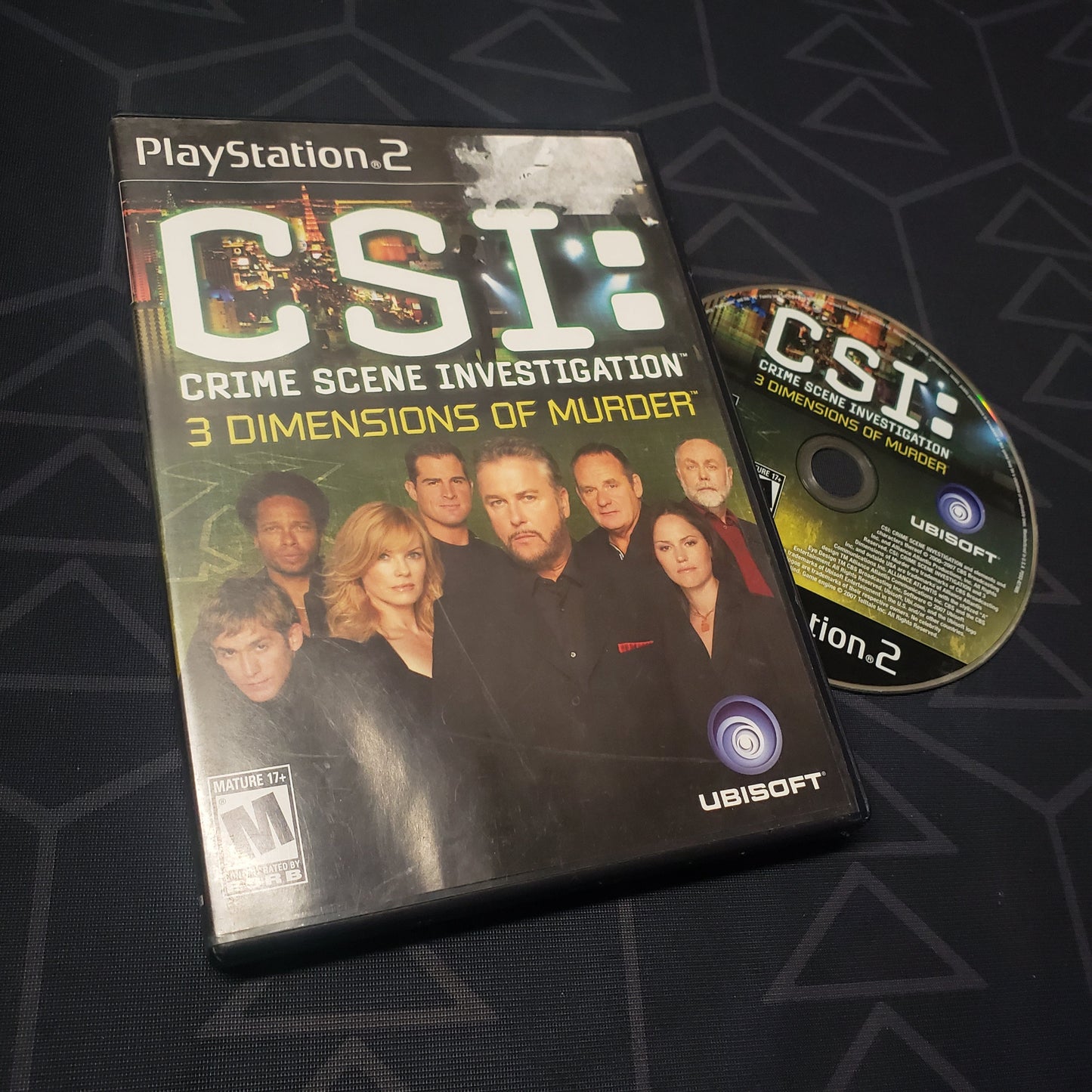 Image shows the case and disc for the video game CSI: 3 Dimensions of Murder for Playstation 2