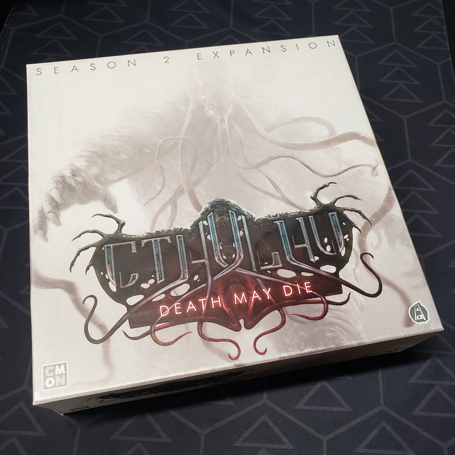 Image shows the front cover of the box of the Season 2 expansion for the board game Cthulhu: Death May Die