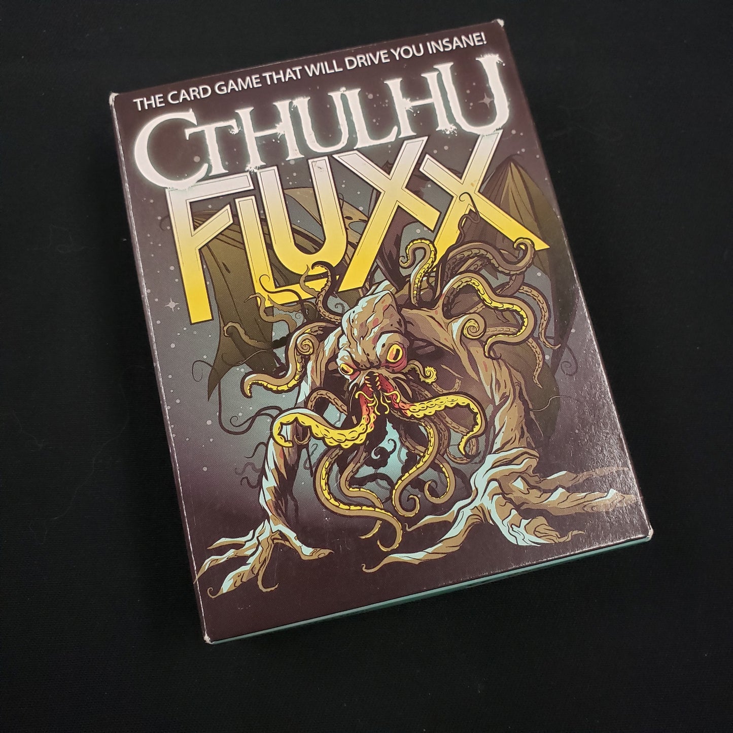 Image shows the front cover of the box of the Cthulhu Fluxx card game