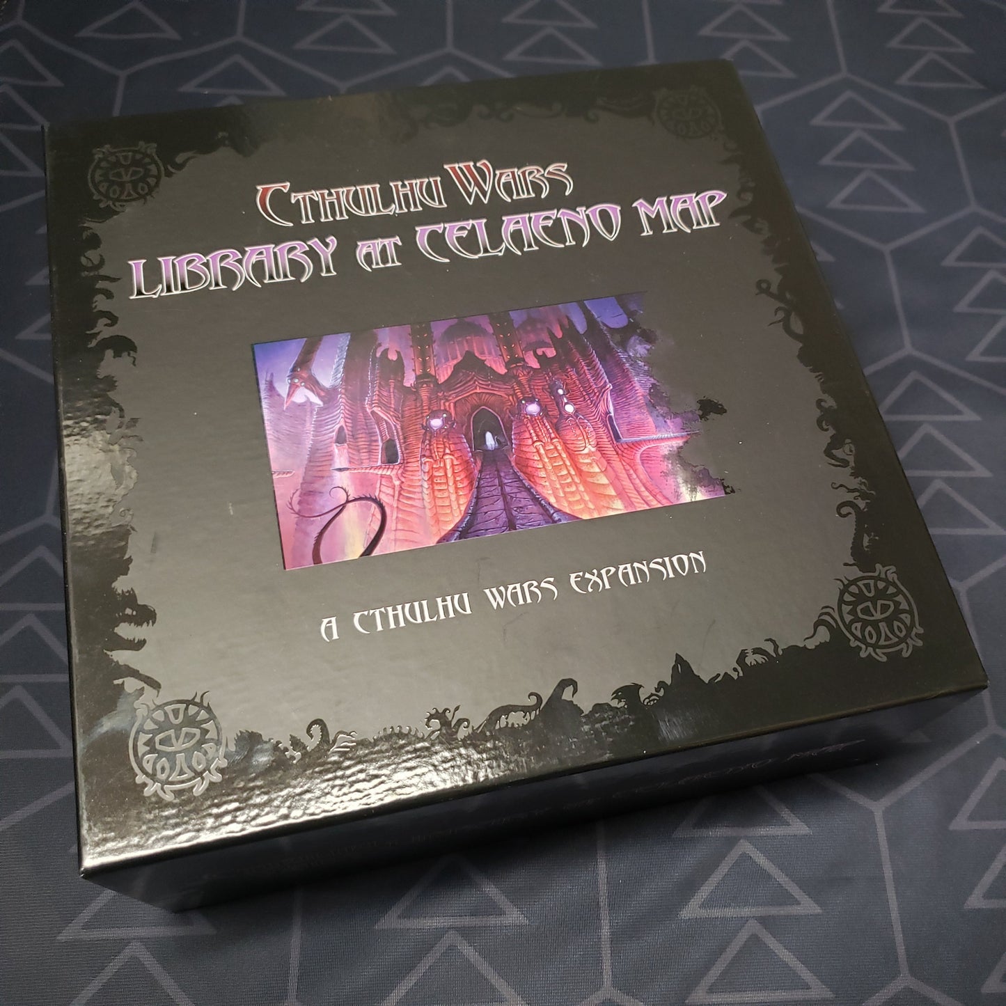 Image shows the front of the box for the Library at Celaeno Map Expansion for the Cthulhu Wars board game