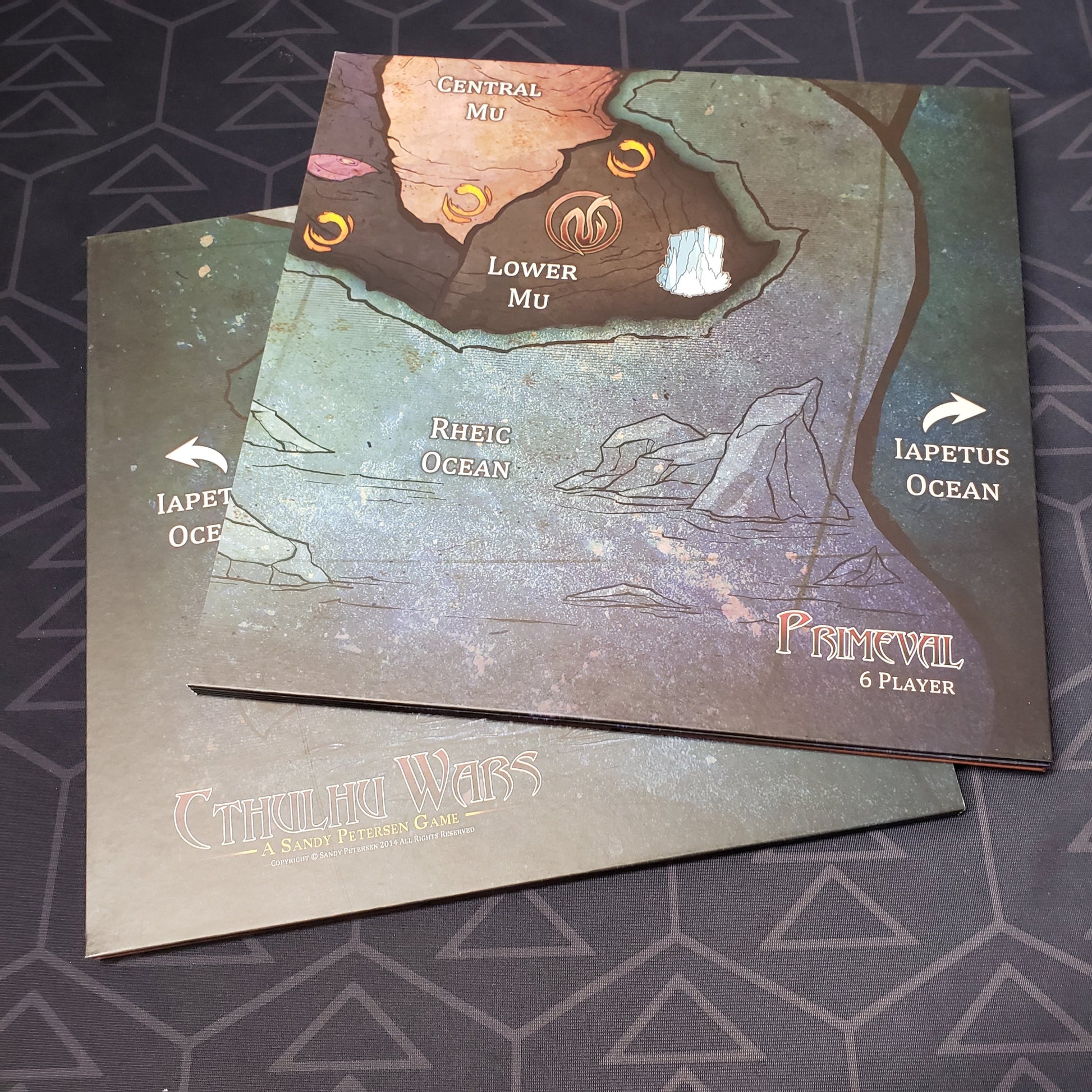 Image shows the two boards that make up the Six to Eight Player Primeval Earth Map expansion for the board game Cthulhu Wars