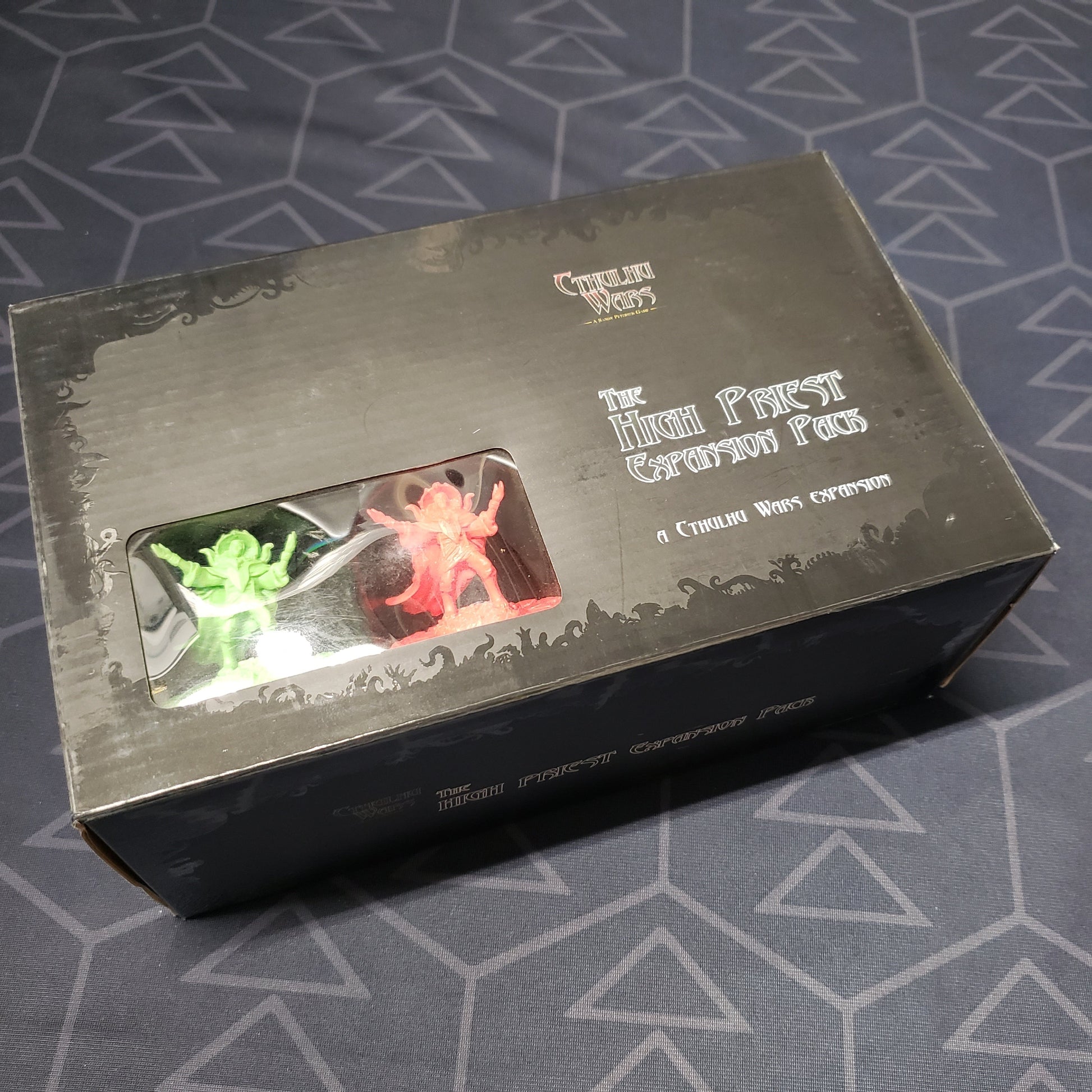 Image shows the front cover of the box of the High Priest expansion for the board game Cthulhu Wars