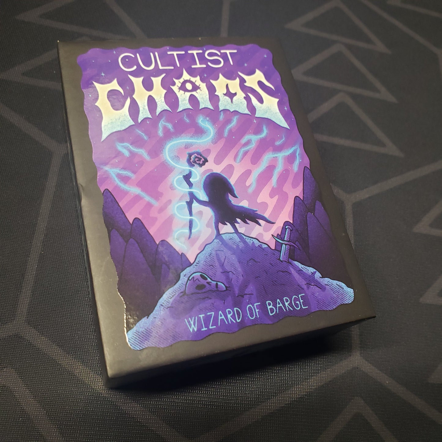 Image shows the front cover of the box for the Cultist Chaos card game