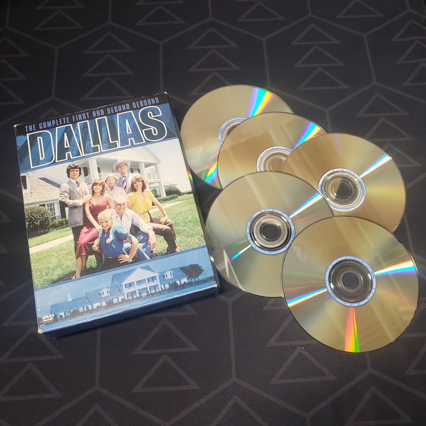 Image shows the outer case & five discs for Dallas: Seasons 1 + 2 on DVD