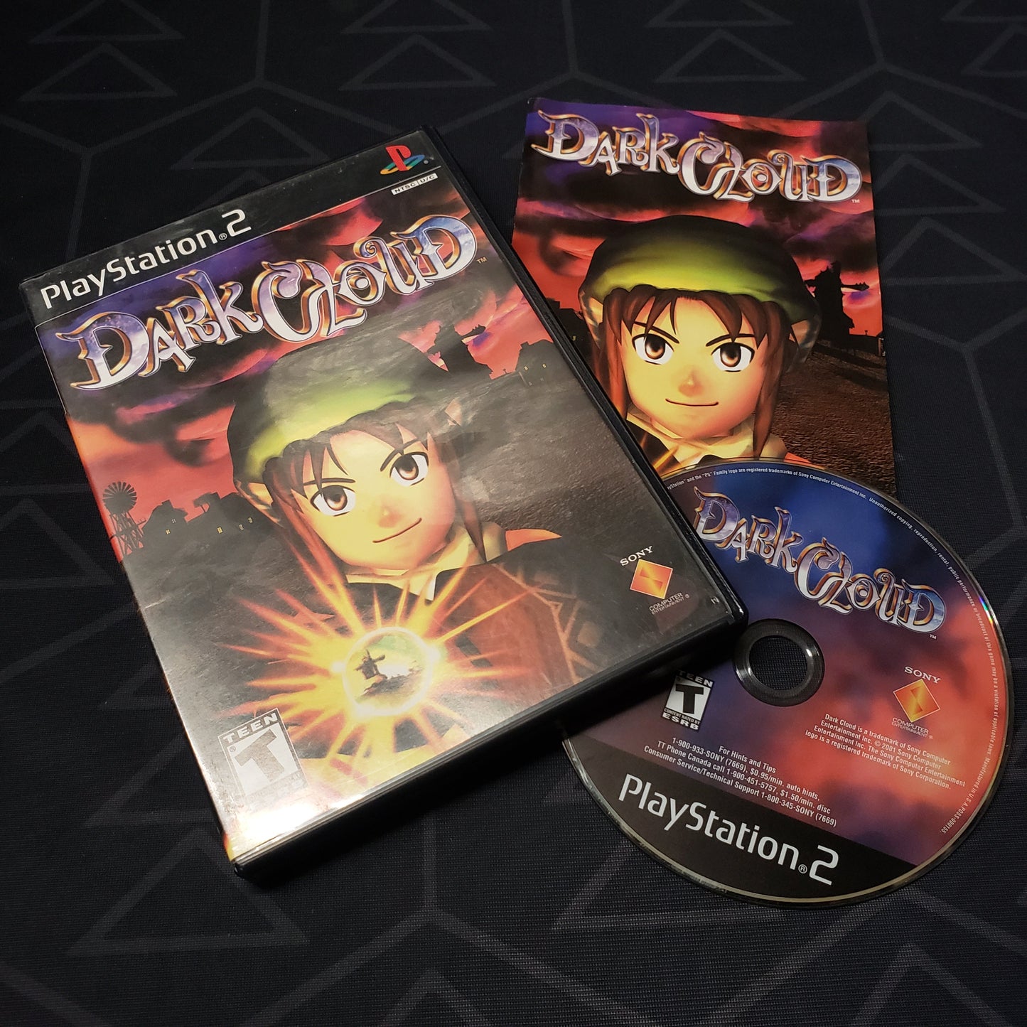 Image shows the case, manual & disc for the video game Dark Cloud for Playstation 2