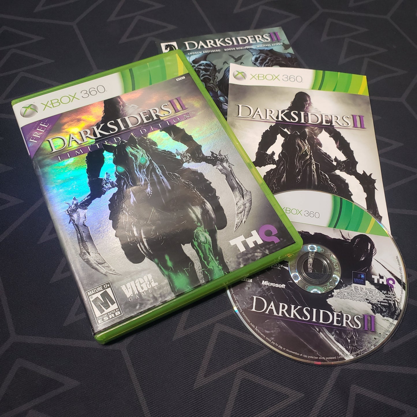 Image shows the case, manual, bonus comic & disc for the video game Darksiders II for Xbox 360