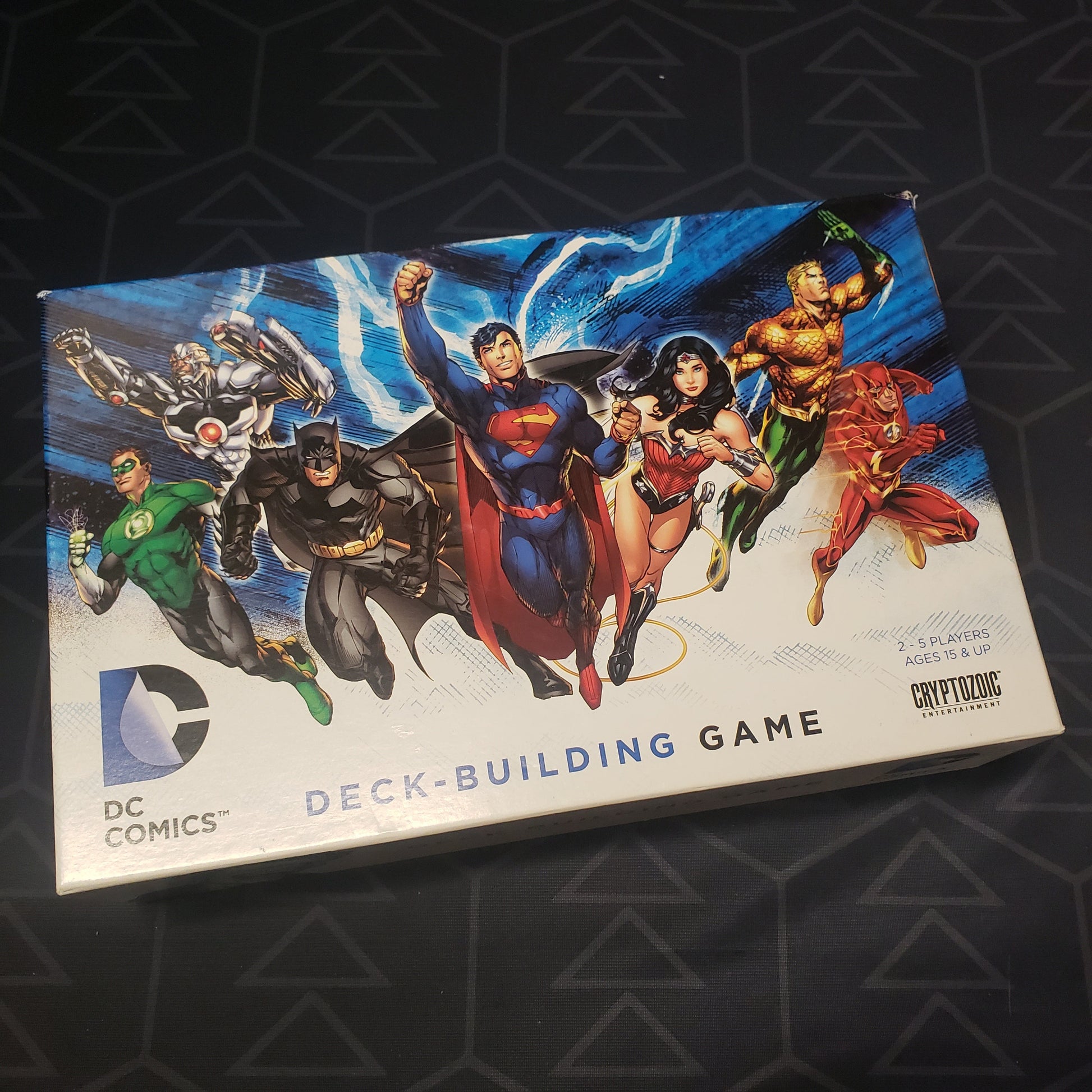 Image shows the front cover of the box of the DC Comics Deckbuilding card game