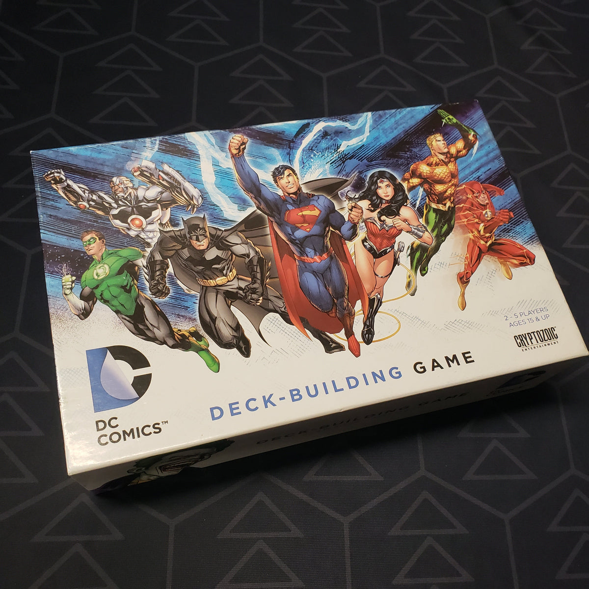 Image shows the front cover of the box of the DC Comics Deckbuilding card game