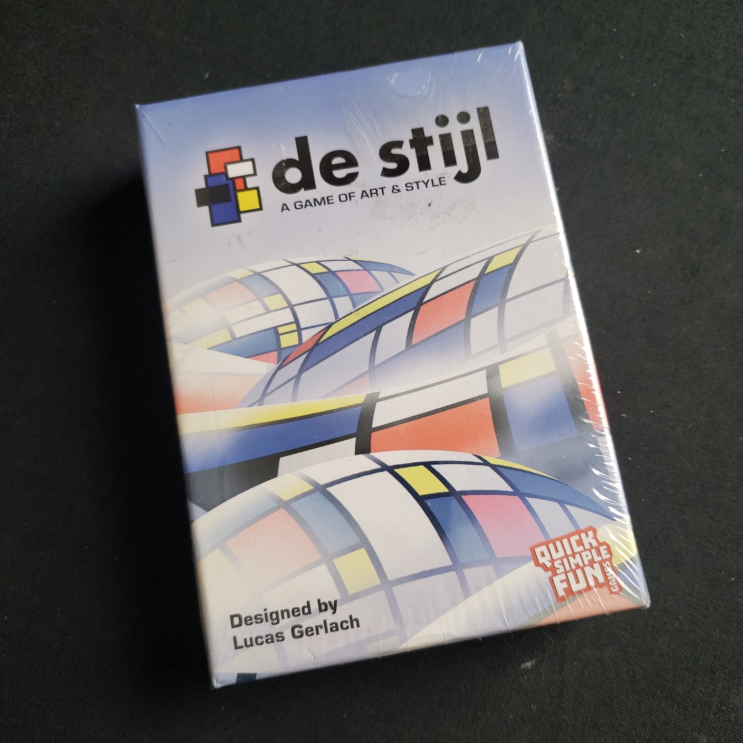 Image shows the front cover of the box of the de Stijl card game
