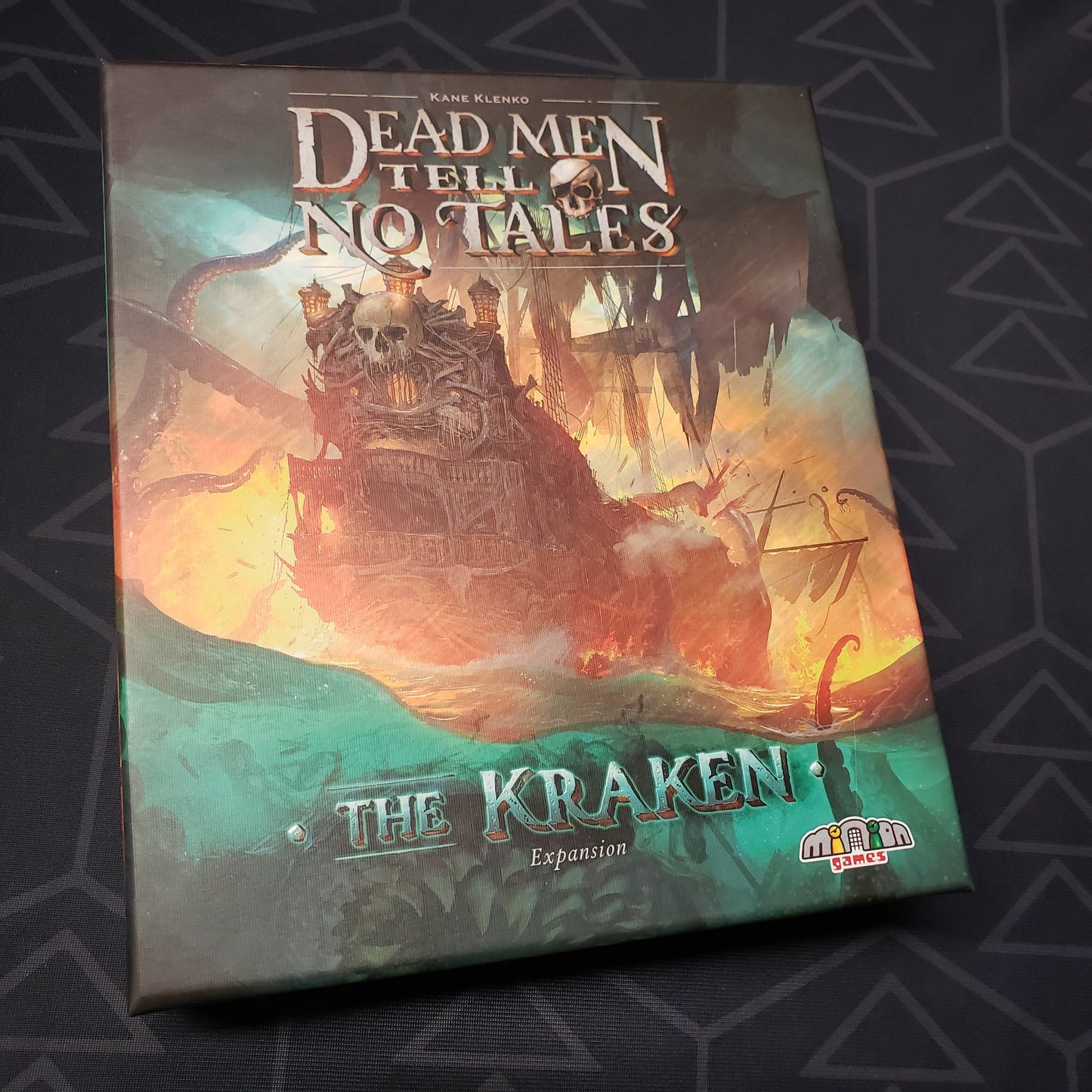 Image shows the front cover of the box of the Kraken expansion for the board game Dead Men Tell No Tales