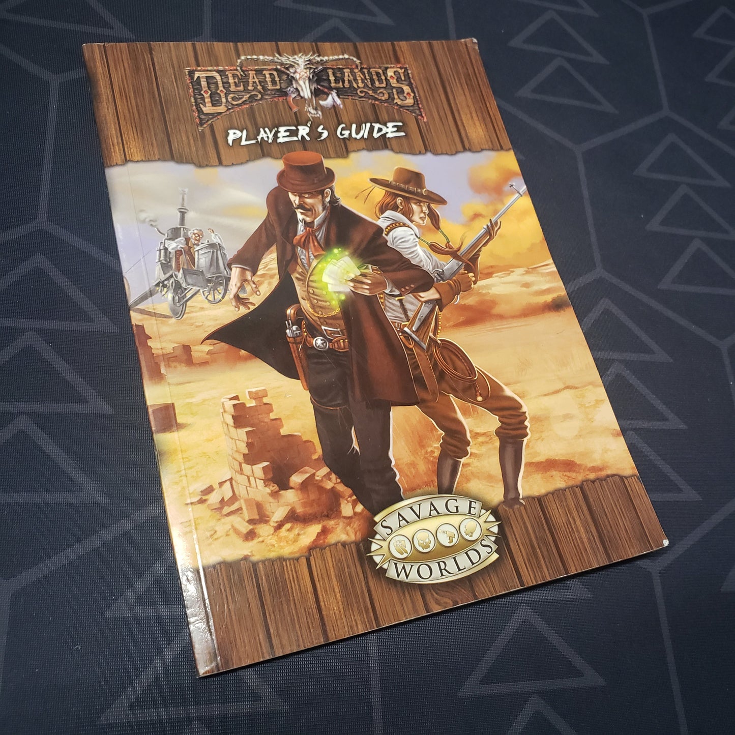 Image shows the front cover of the Player's Guide book for the roleplaying game Deadlands Reloaded