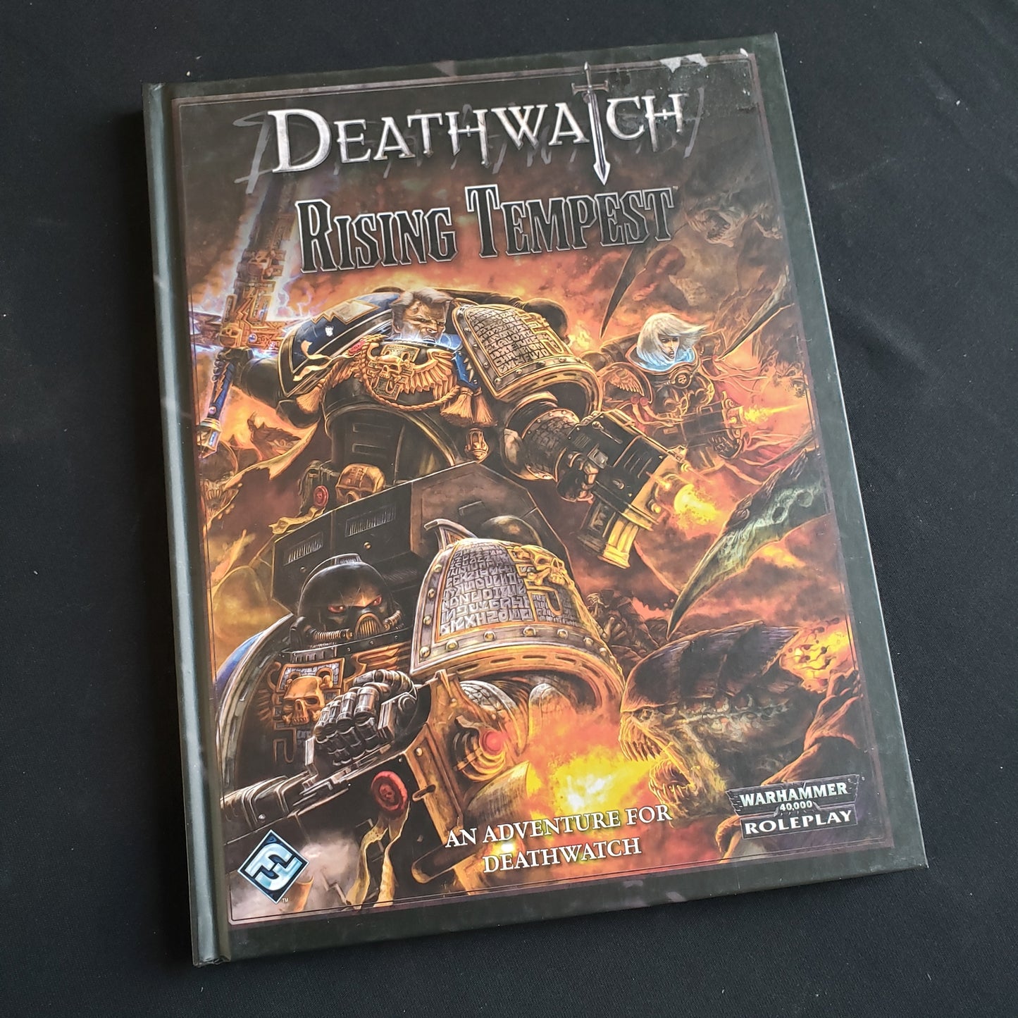 Image shows the front cover of the Rising Tempest book for the roleplaying game Deathwatch