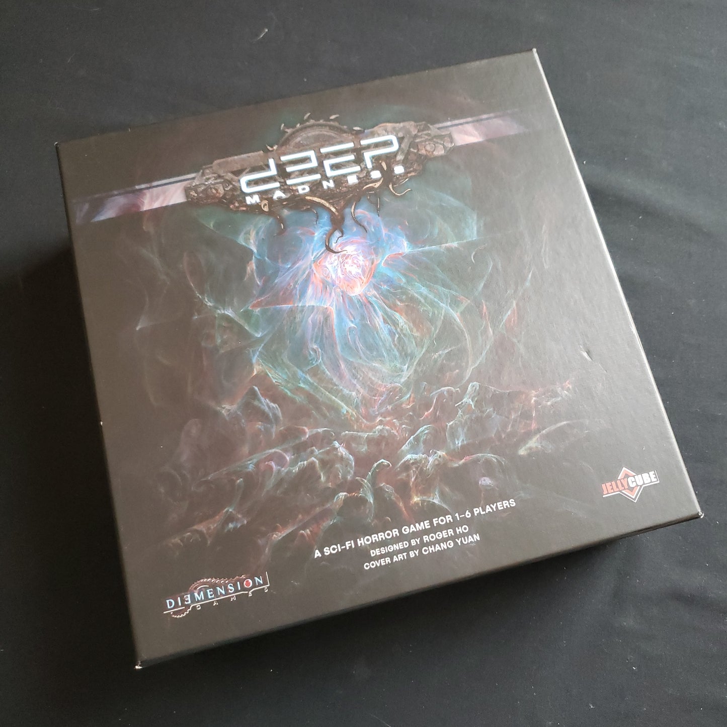Image shows the front cover of the box of the Deep Madness board game