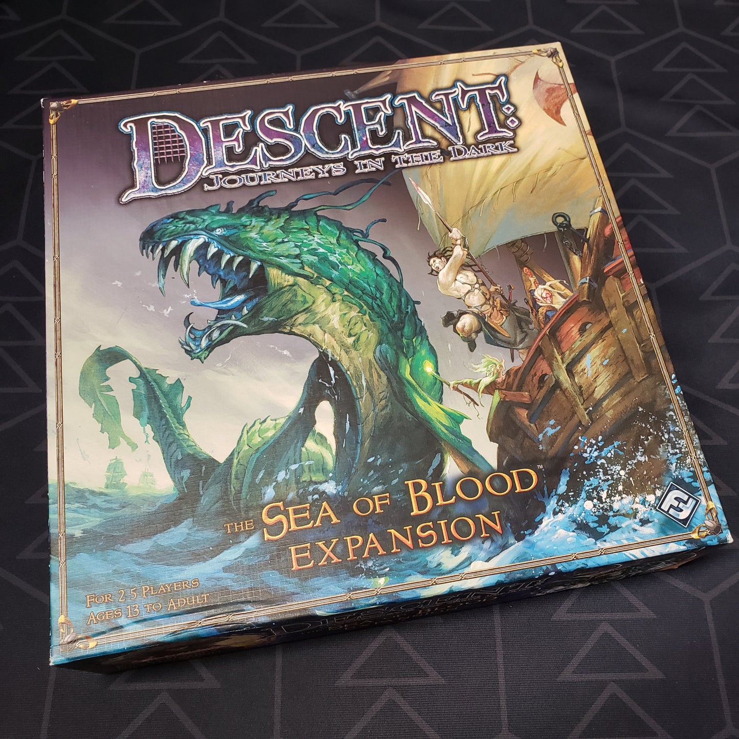 Image shows the front cover of the box of the Sea of Blood expansion for the board game Descent: First Edition