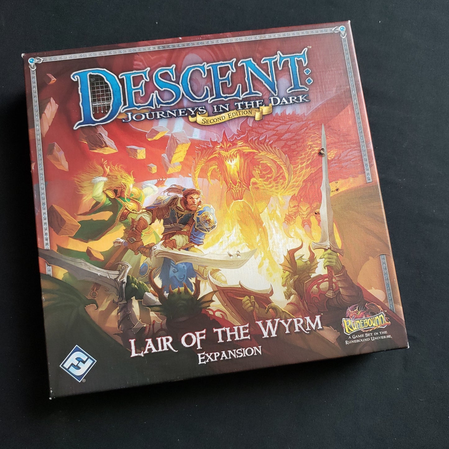 Image shows the front cover of the box of the Lair of the Wyrm expansion for the board game Descent: Journeys in the Dark