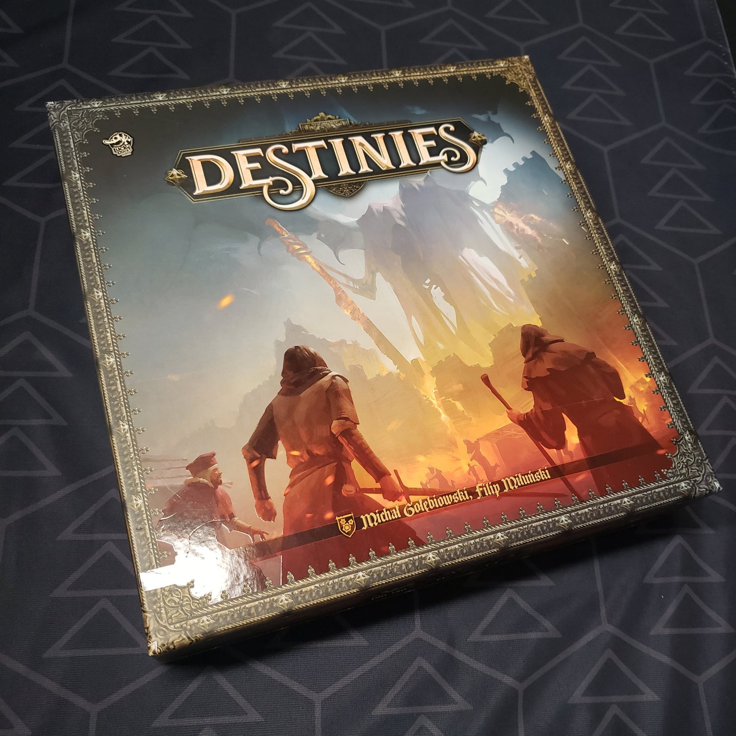 Image shows the front cover of the box of the Destinies board game