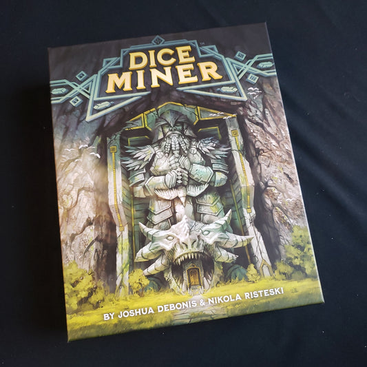 Image shows the front cover of the box of the Dice Miner board game