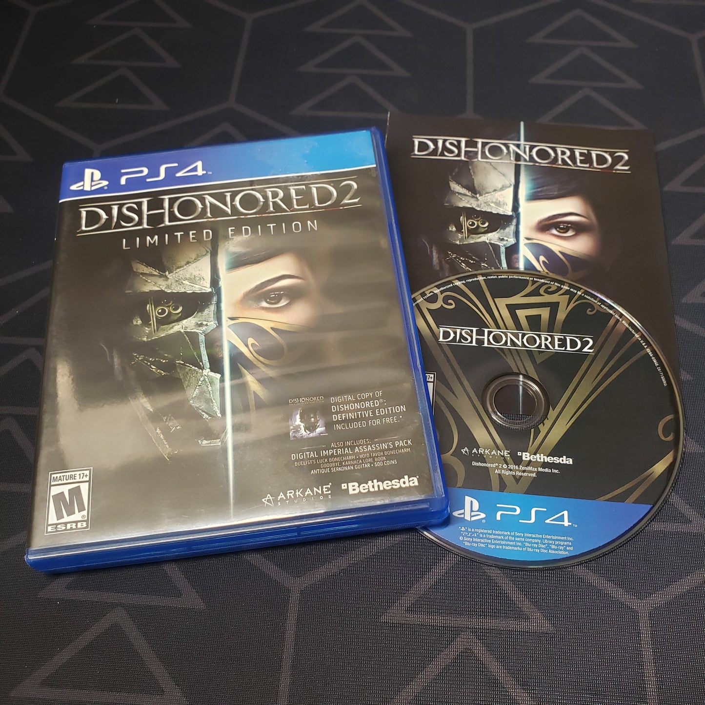 Image shows the case, manual & disc for the video game Dishonored 2 for Playstation 4