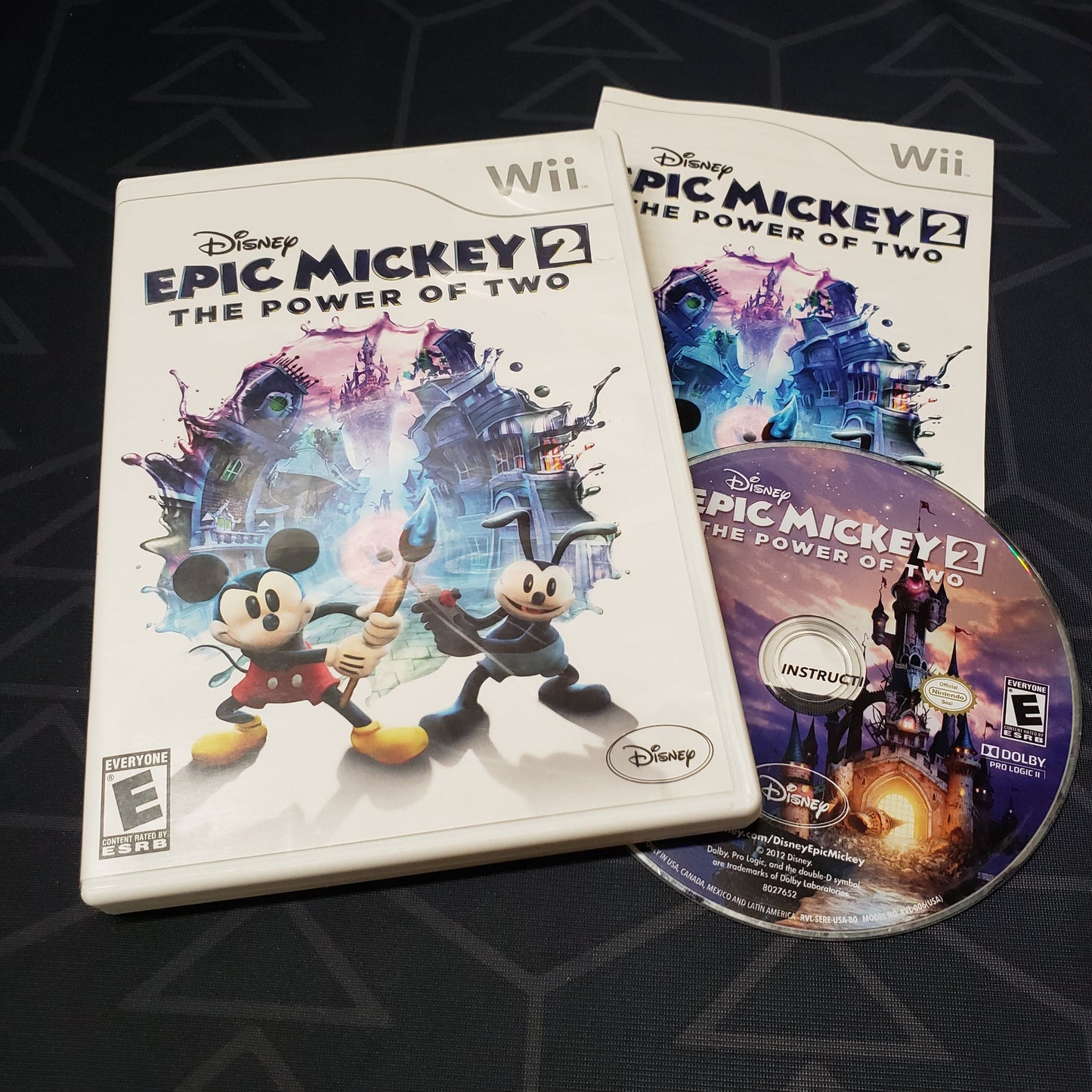 Image shows the case, manual and disc for the video game Disney Epic Mickey 2: The Power of Two for Nintendo Wii