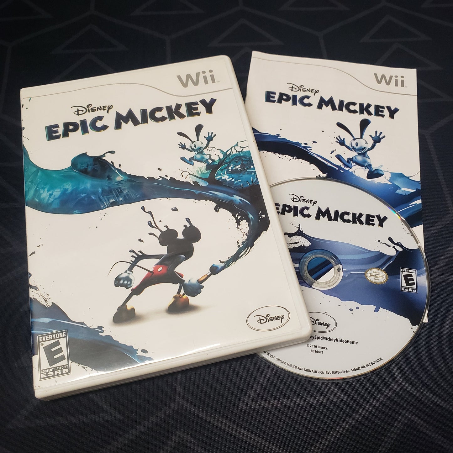 Image shows the case, manual & disc for the video game Disney Epic Mickey for Nintendo Wii