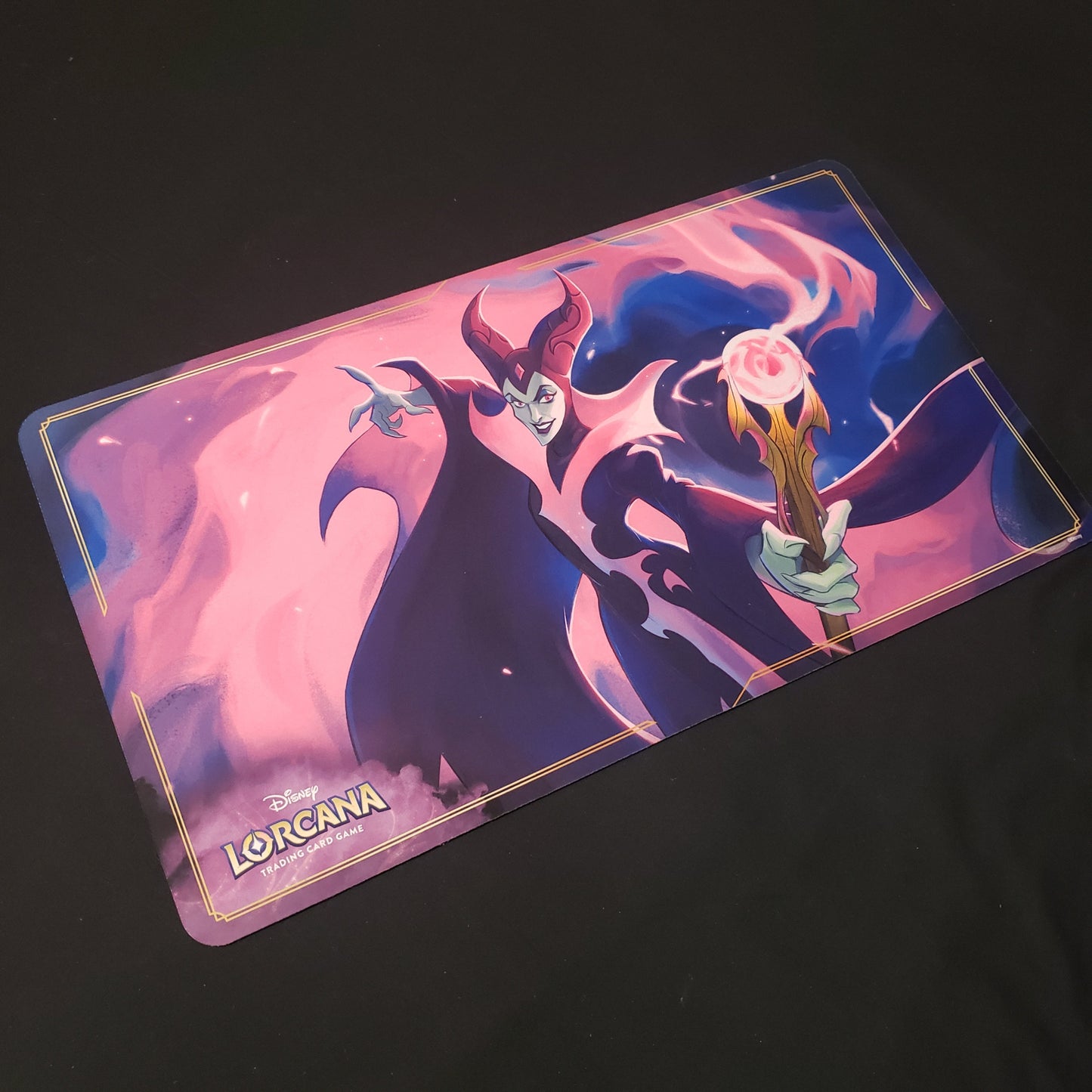 Image shows a playmat featuring First Chapter: Maleficent art for the Disney Lorcana card game