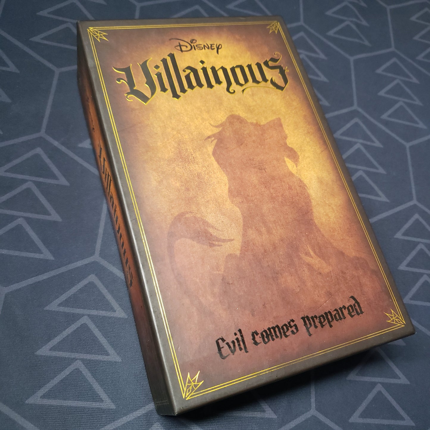 Image shows the front cover of the box of the Disney Villainous: Evil Comes Prepared board game