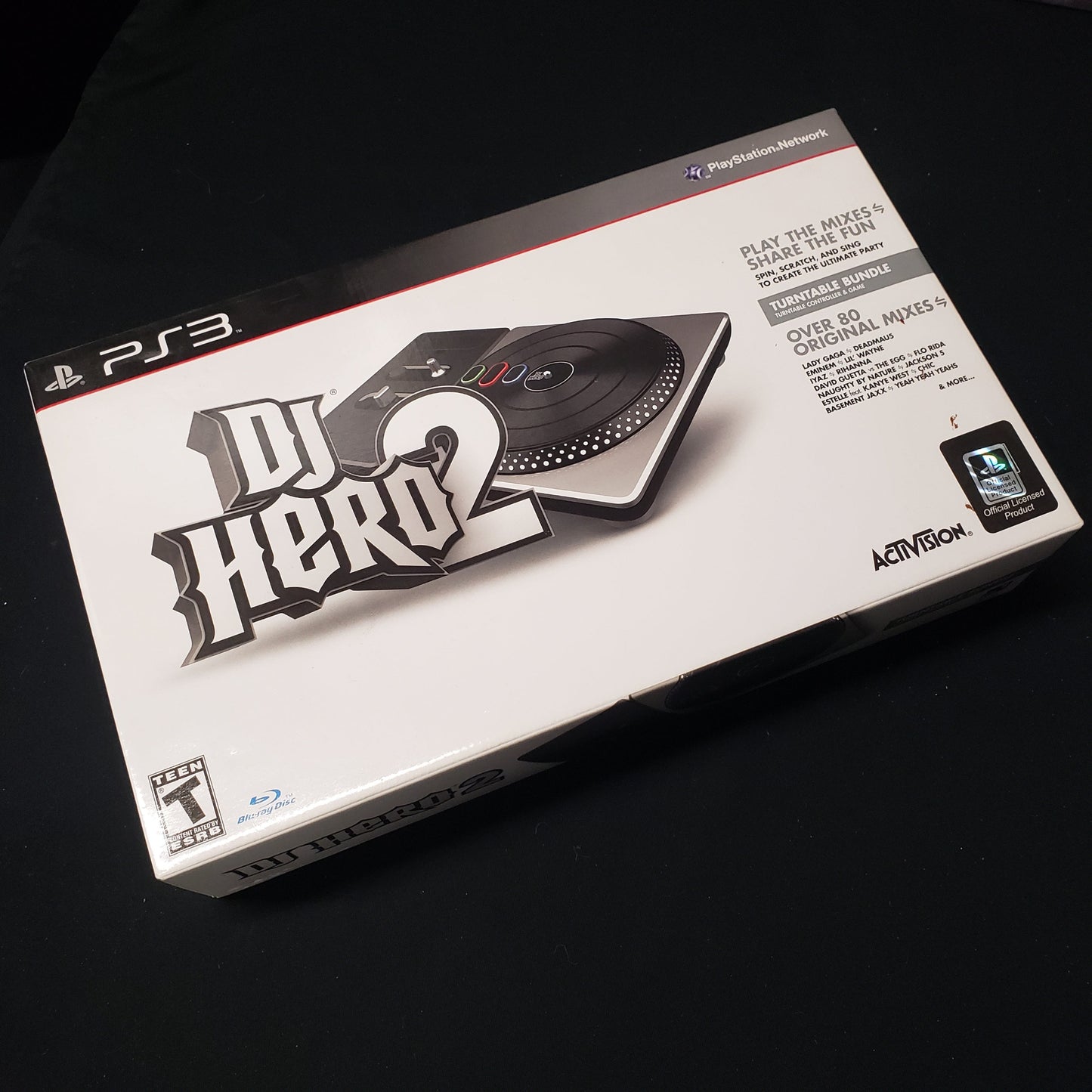 Image shows the front of the Turntable Bundle box for the video game DJ Hero 2 for Playstation 3